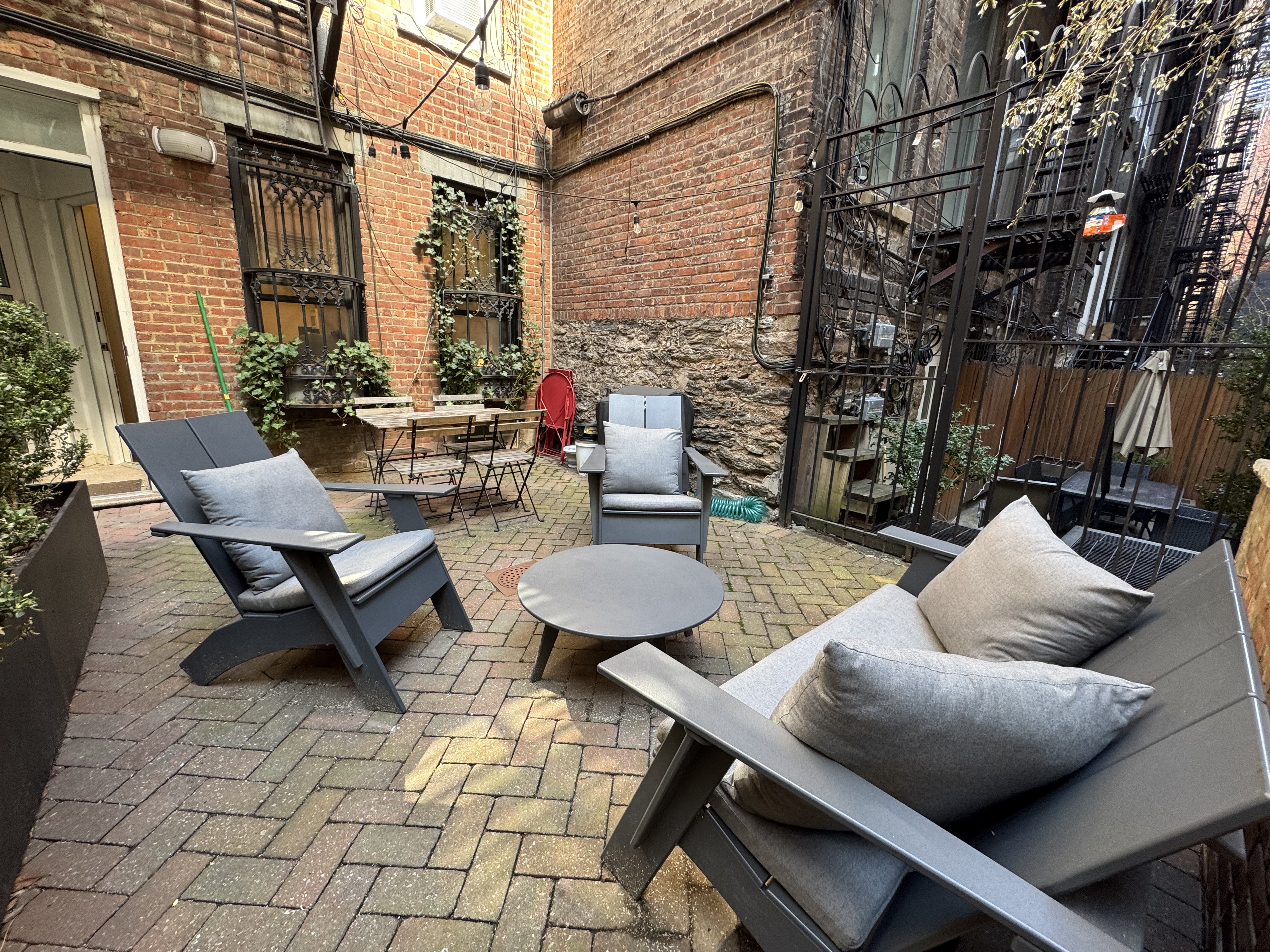 a balcony with furniture and a potted plant