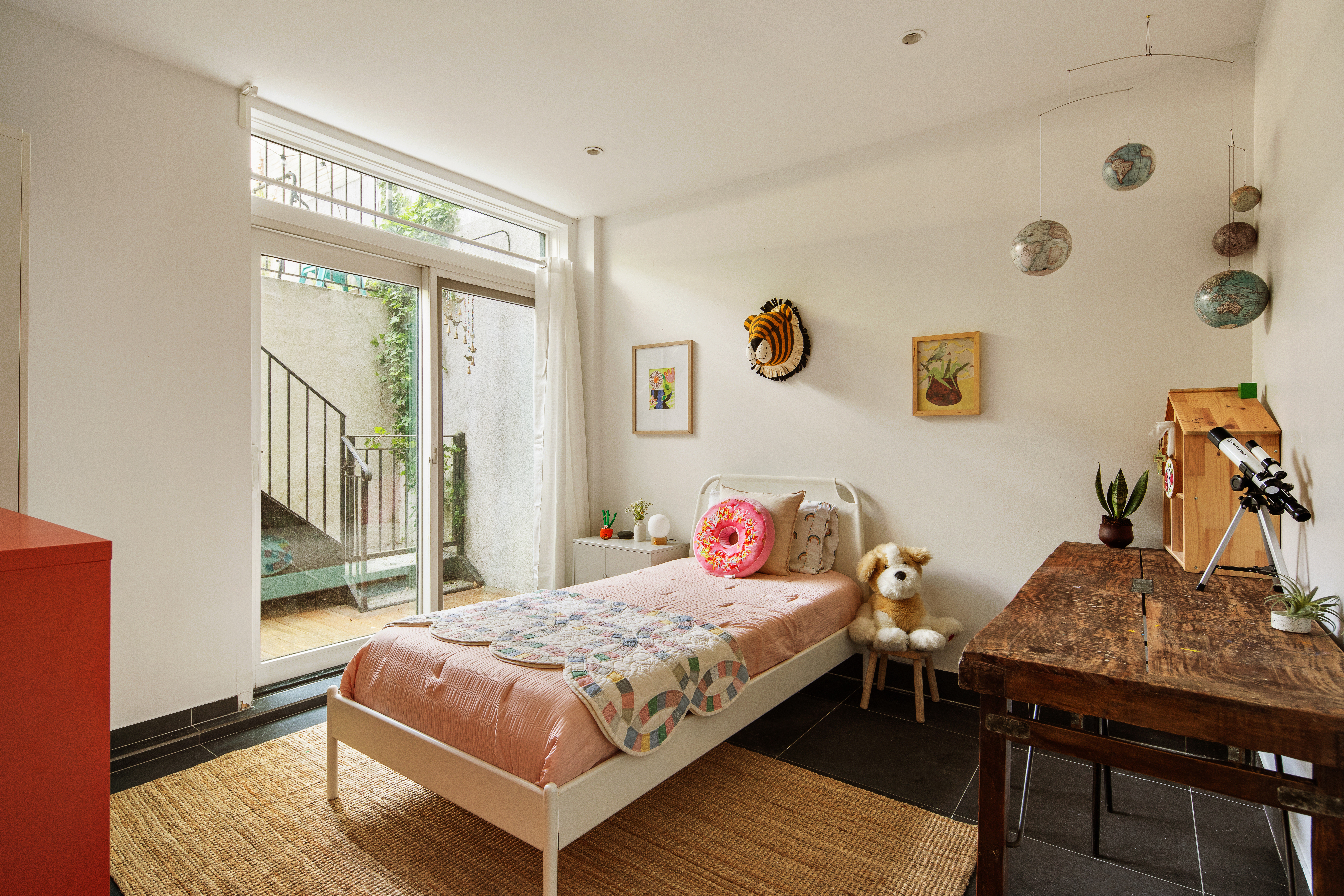 161 Jackson Street, Unit 1 Brooklyn, NY 11211 - Photo 7 of 11 a bedroom with a bed and wooden floor
