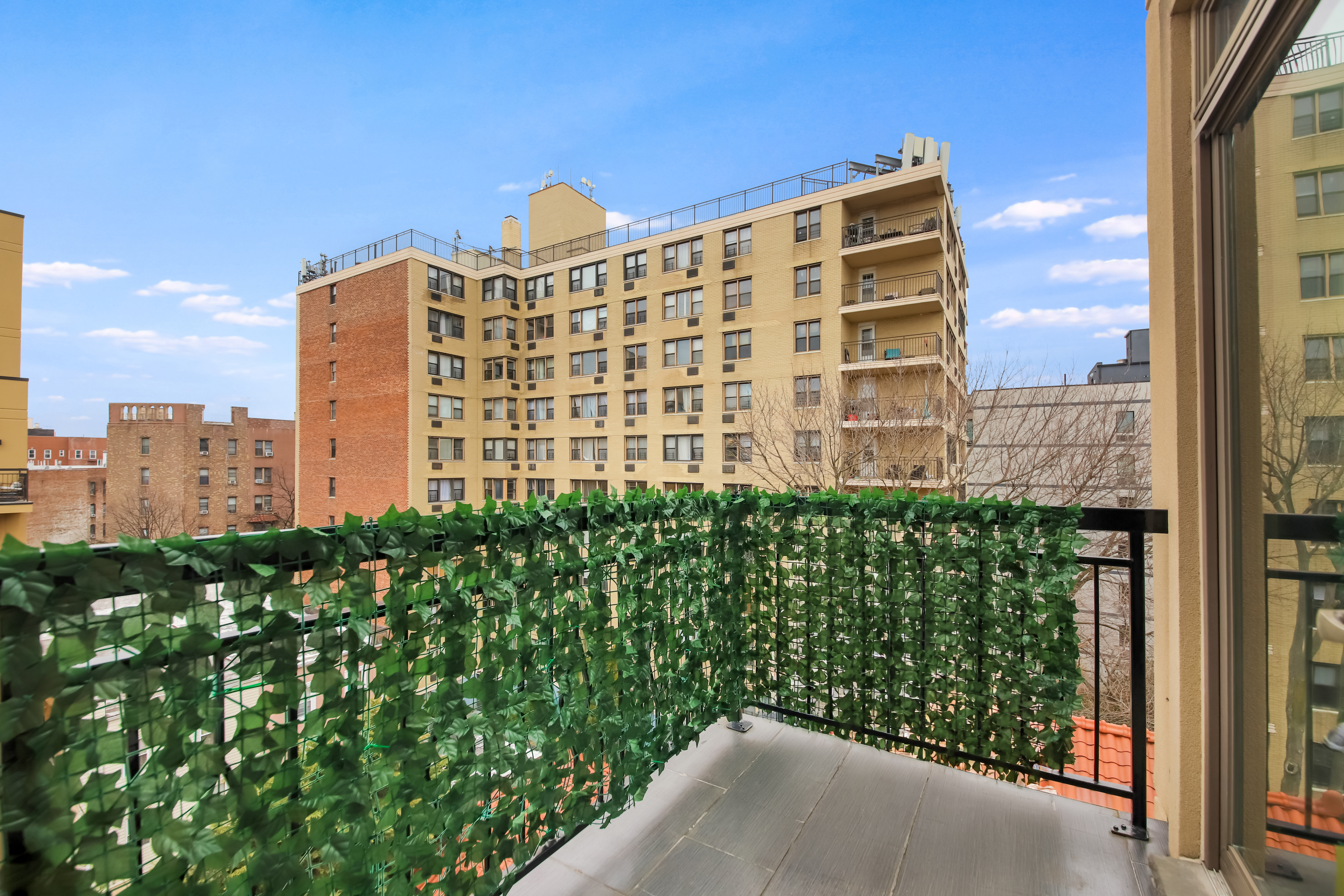 1756 Ocean Avenue, Unit 6D Brooklyn, NY 11230 - Photo 3 of 11 a view of a city with tall buildings
