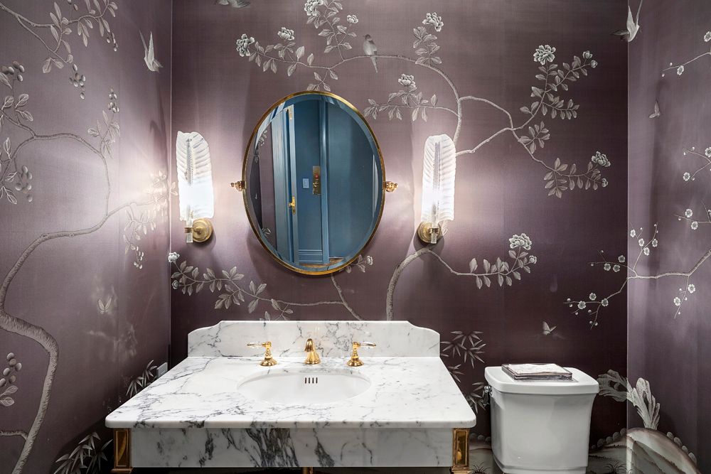 a bathroom with a sink a toilet and mirror