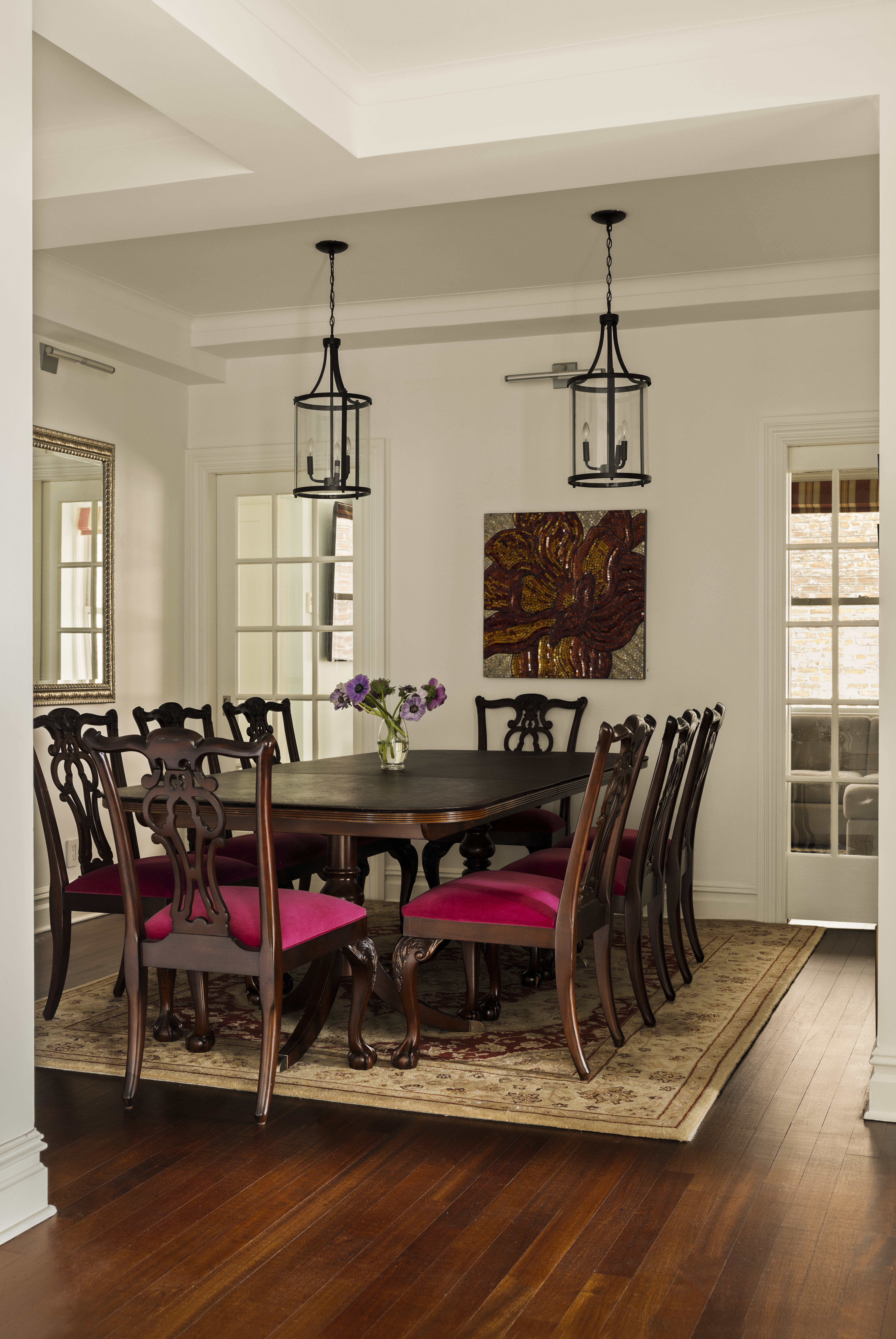 1158 5th Avenue, Unit 4A Manhattan, NY 10128 - Photo 5 of 23 a view of a dining room with furniture wooden floor and chandelier