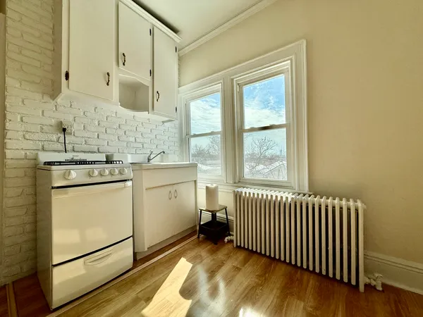 a utility room with cabinets