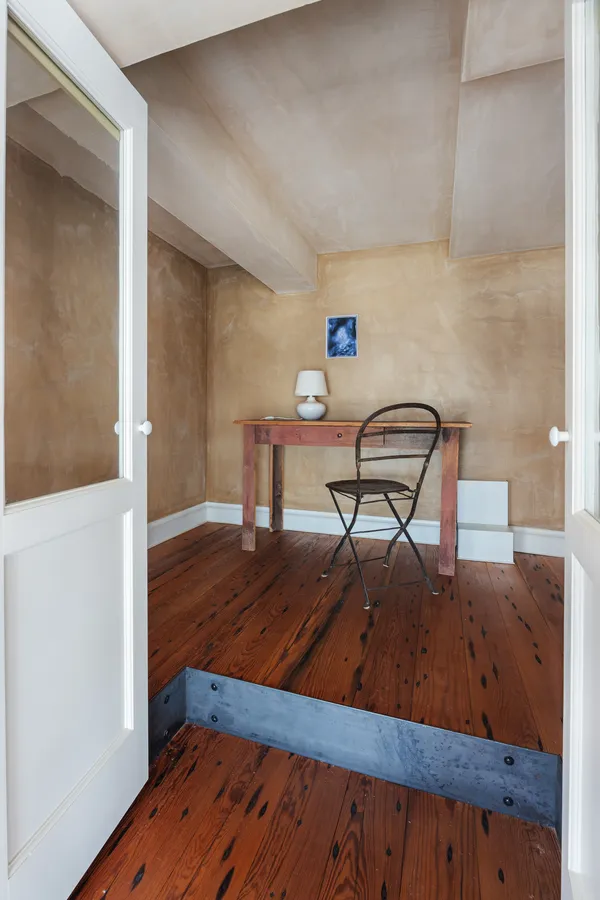 a view of a living room and wooden floor
