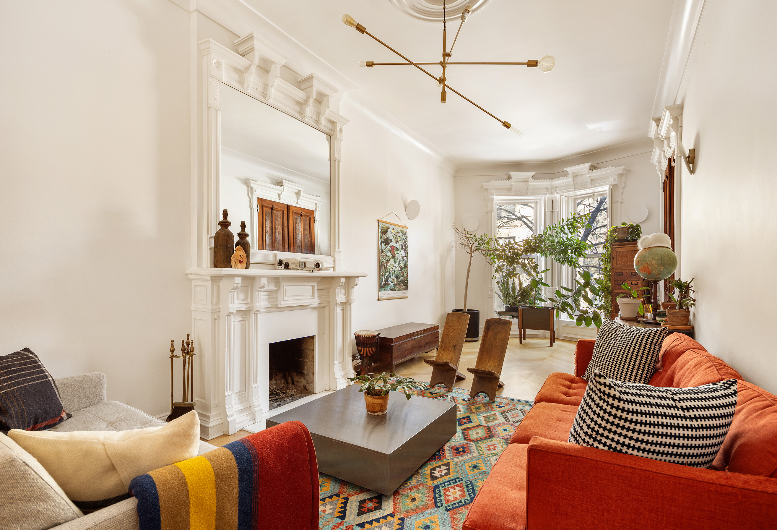 240 St Johns Place, Unit 1 Brooklyn, NY 11217 - Photo 1 of 13 a living room with furniture fireplace and a flat screen tv