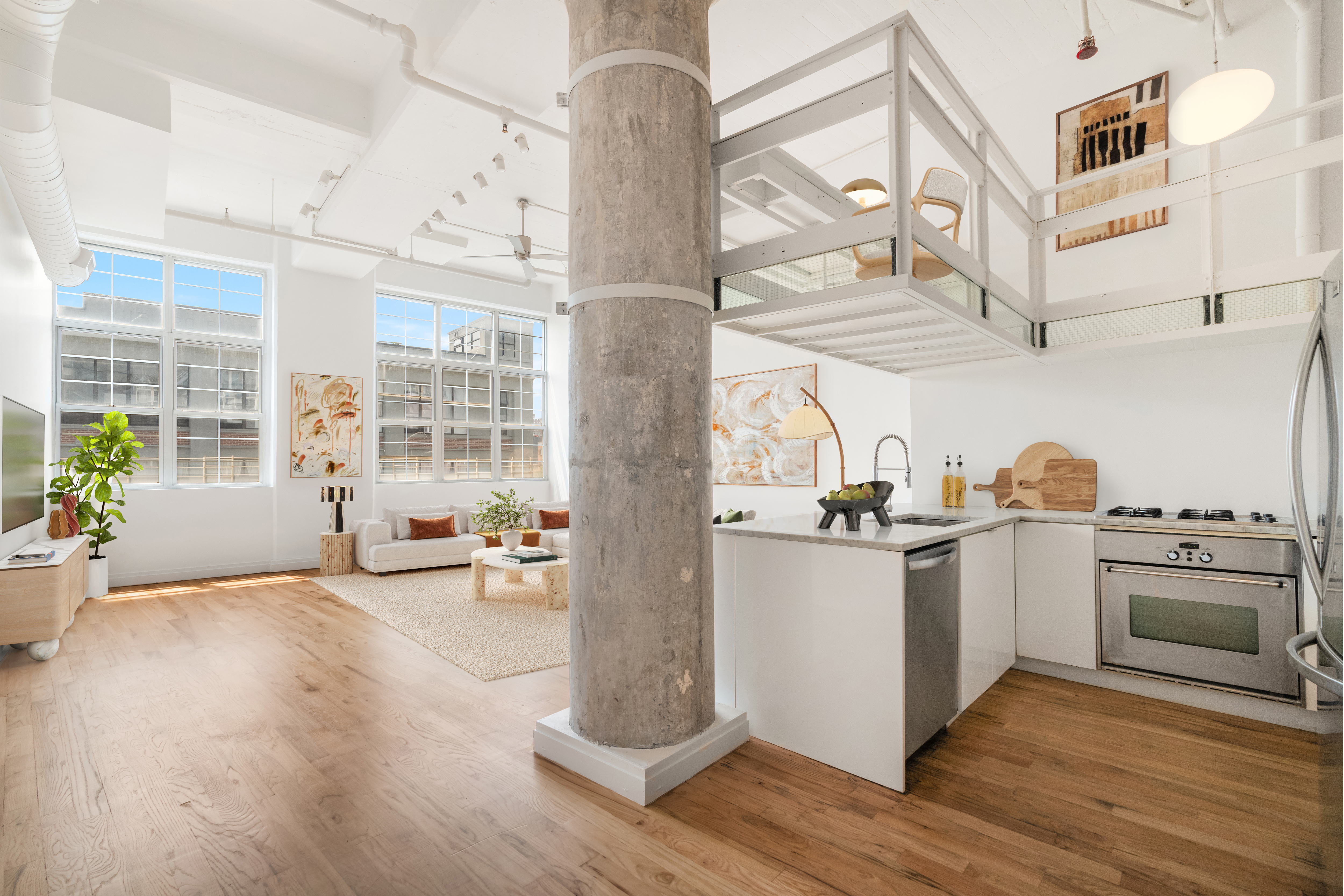 a kitchen with stainless steel appliances a stove a sink and a refrigerator