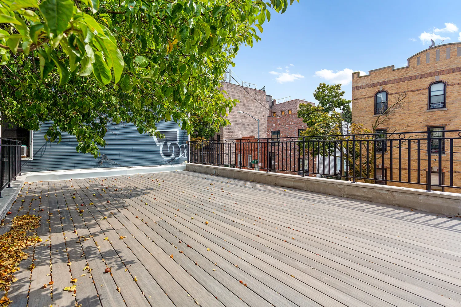 a view of a house with wooden fence