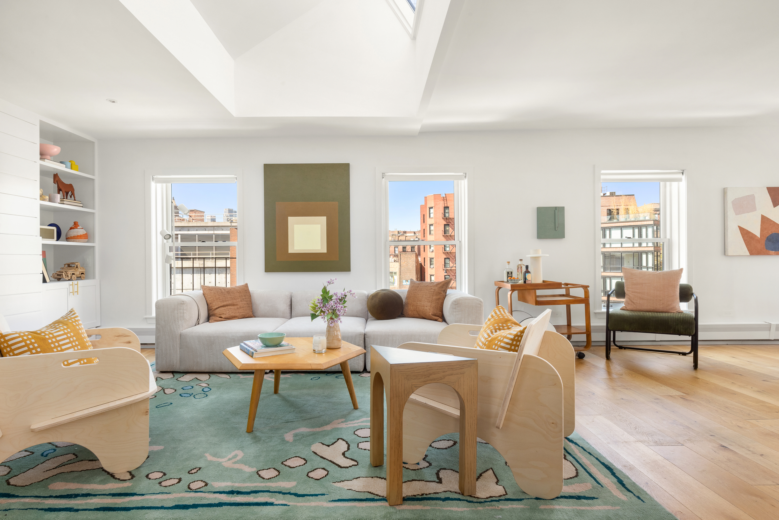 160 West 11th Street, Unit PH Manhattan, NY 10011 - Photo 2 of 16 a living room with furniture dining table and a window