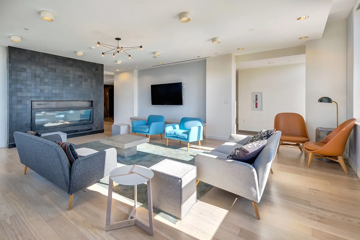 626 Flatbush Avenue, Unit 12D Brooklyn, NY 11225 - Photo 6 of 18 a living room with furniture a flat screen tv and a large window