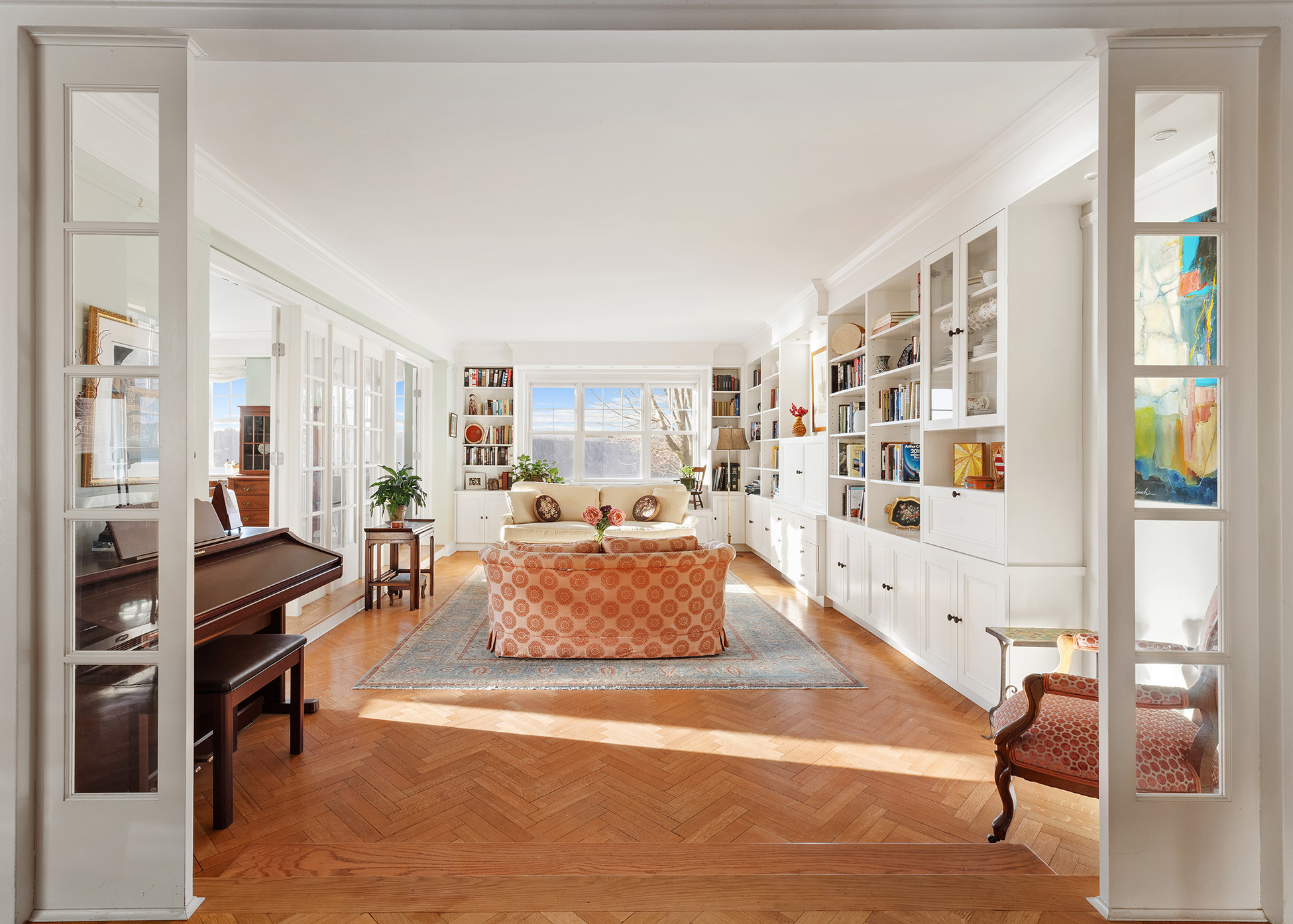 140 Cabrini Boulevard, Unit 18/19 Manhattan, NY 10033 - Photo 3 of 21 a living room with furniture and a large window