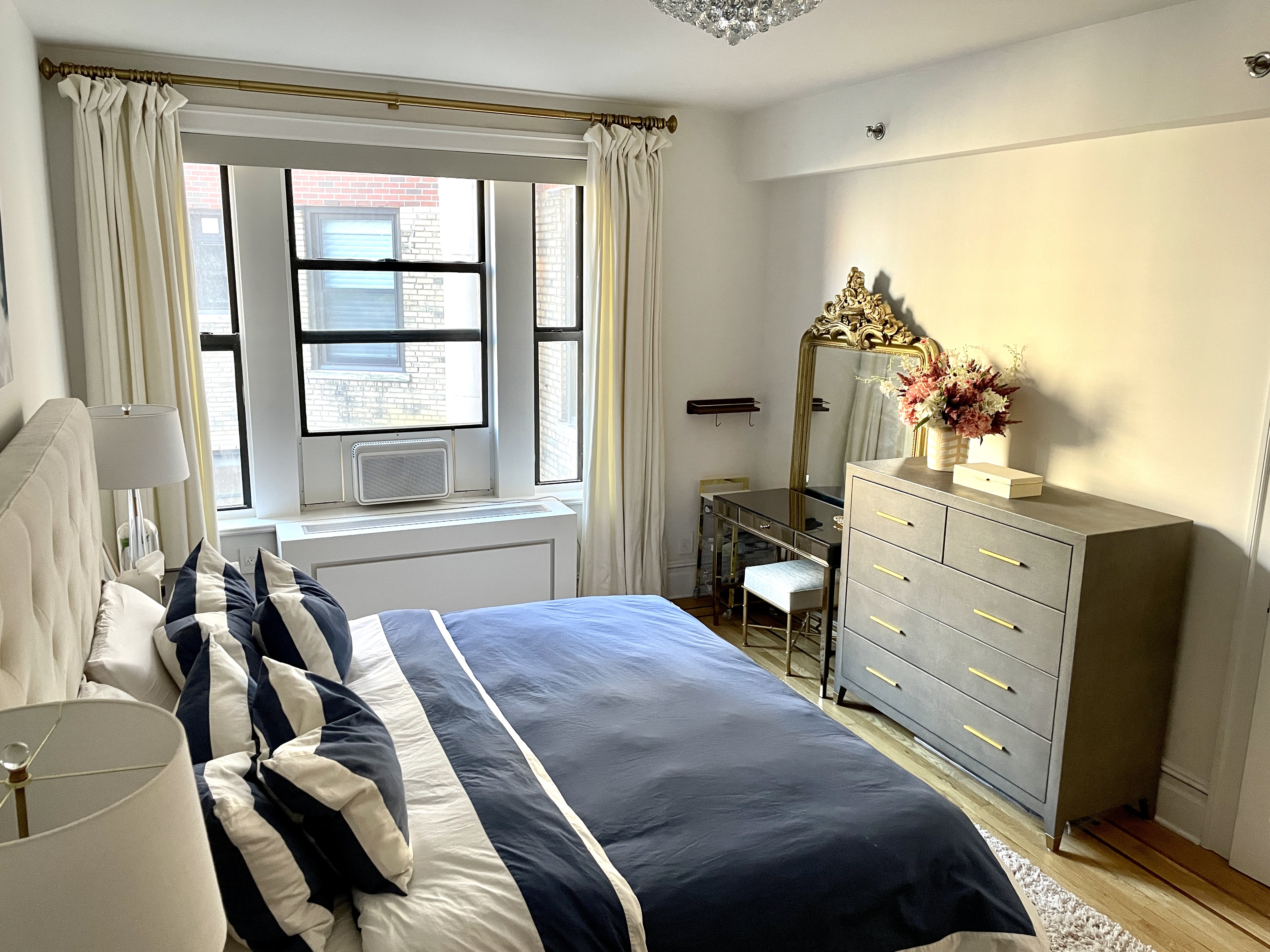 203 West 90th Street, Unit 6B Manhattan, NY 10024 - Photo 17 of 22 a bedroom with a bed and a flat tv screen on the dresser