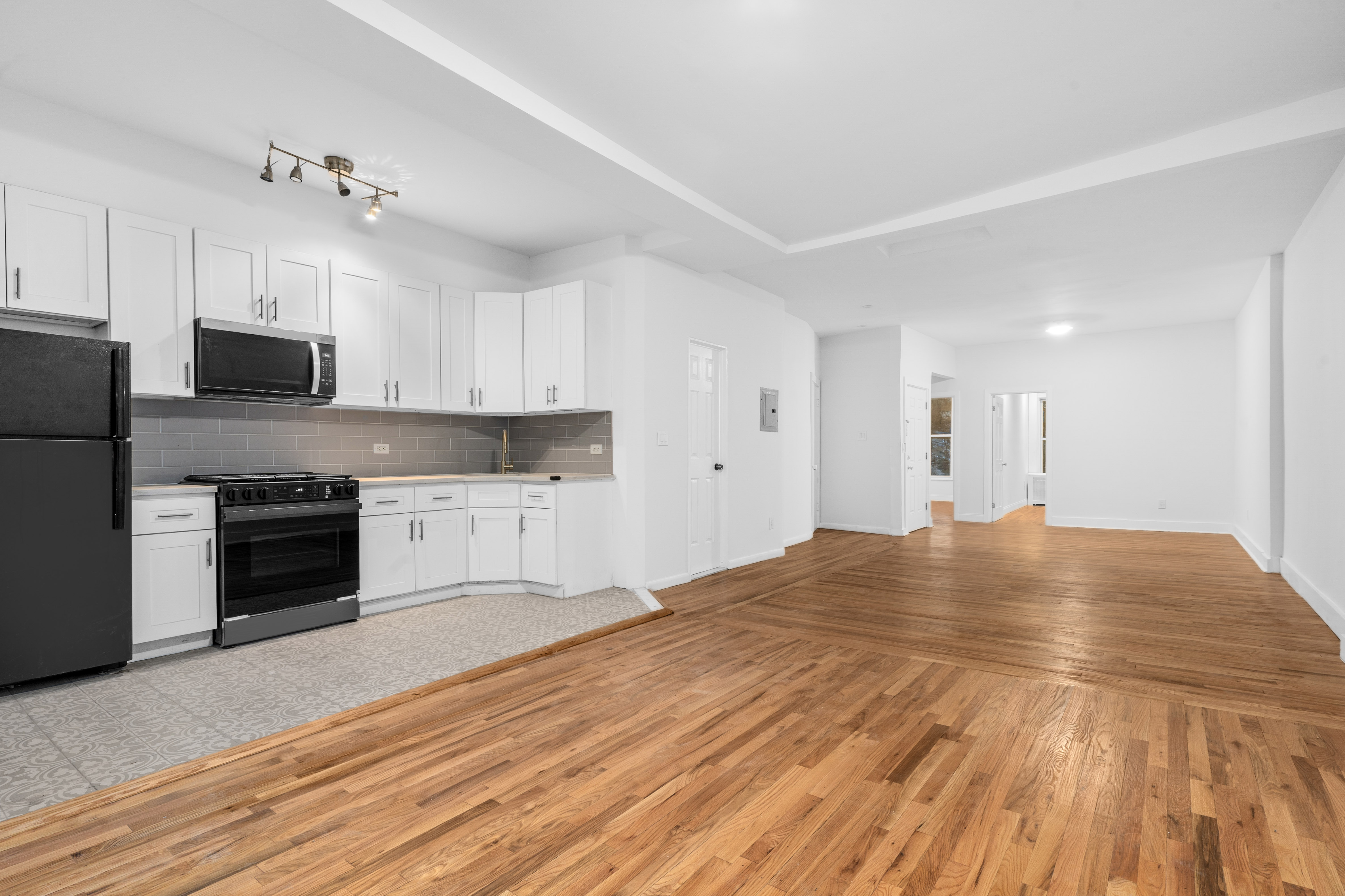 339 East 29th Street Brooklyn, NY 11226 - Photo 8 of 21 a view of a kitchen with microwave and cabinets