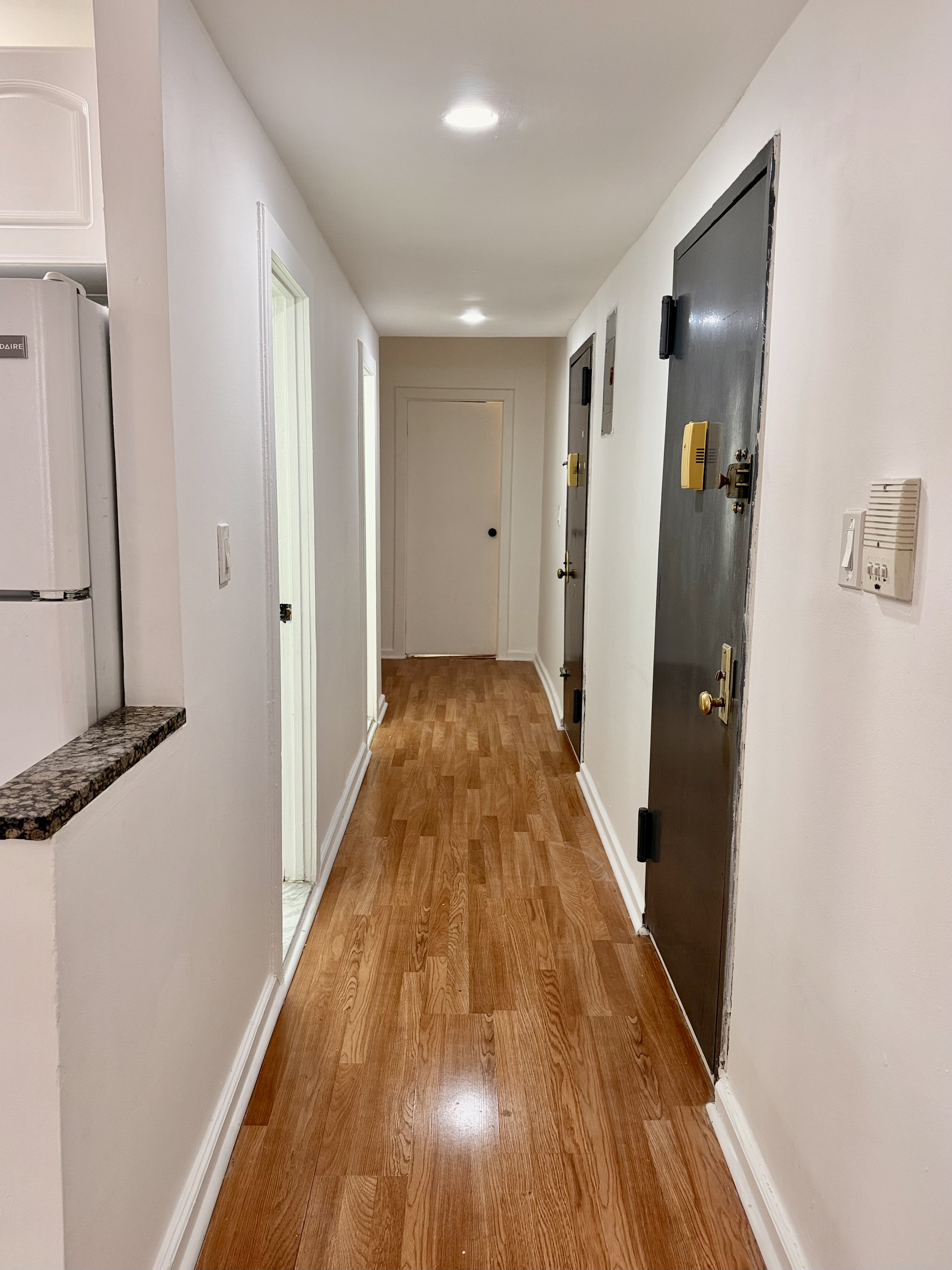 1997 3rd Avenue, Unit 1A Manhattan, NY 10029 - Photo 10 of 23 a view of a hallway with wooden floor