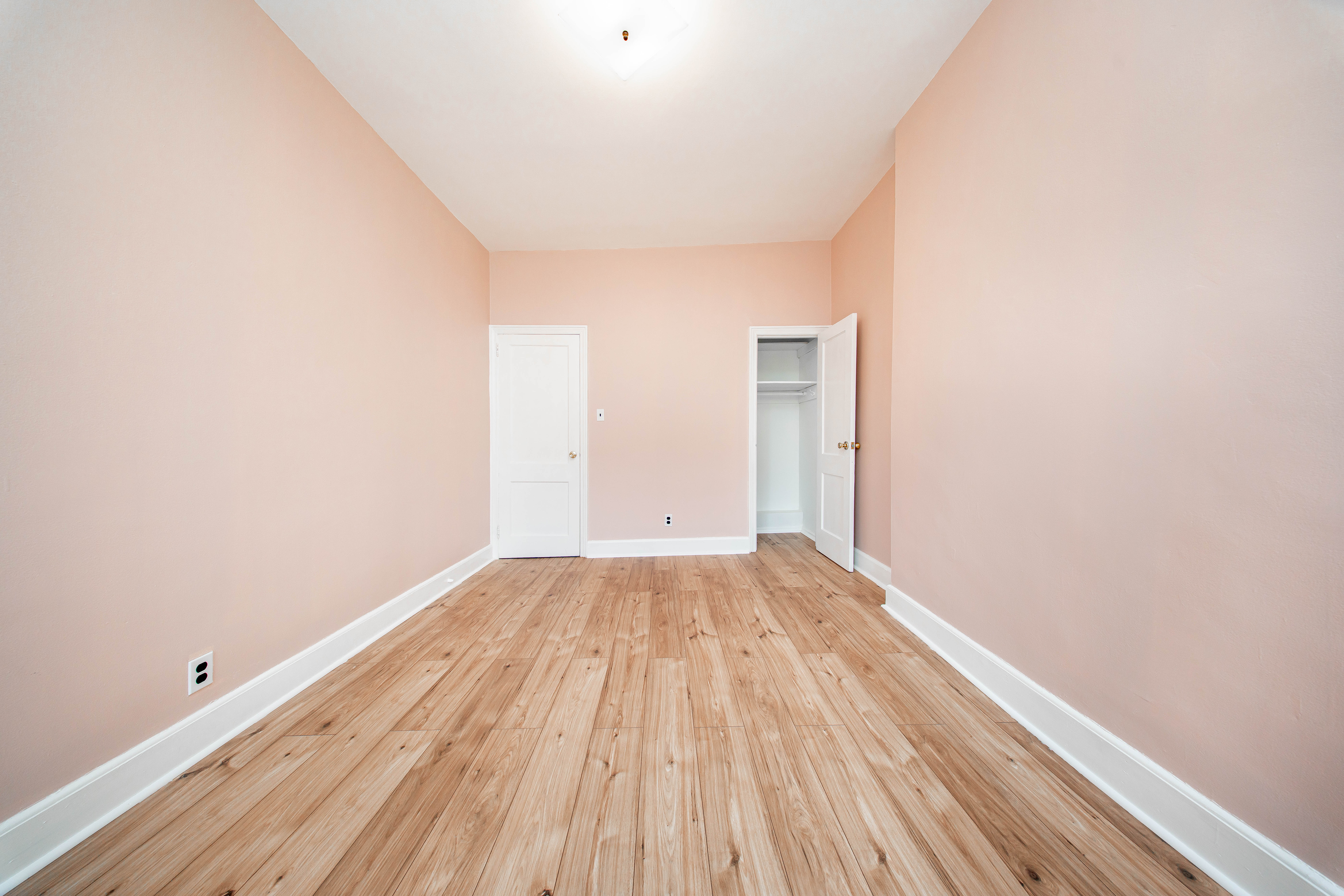 22-17 Astoria Boulevard, Unit 2W Queens, NY 11102 - Photo 7 of 10 a view of a room with wooden floor