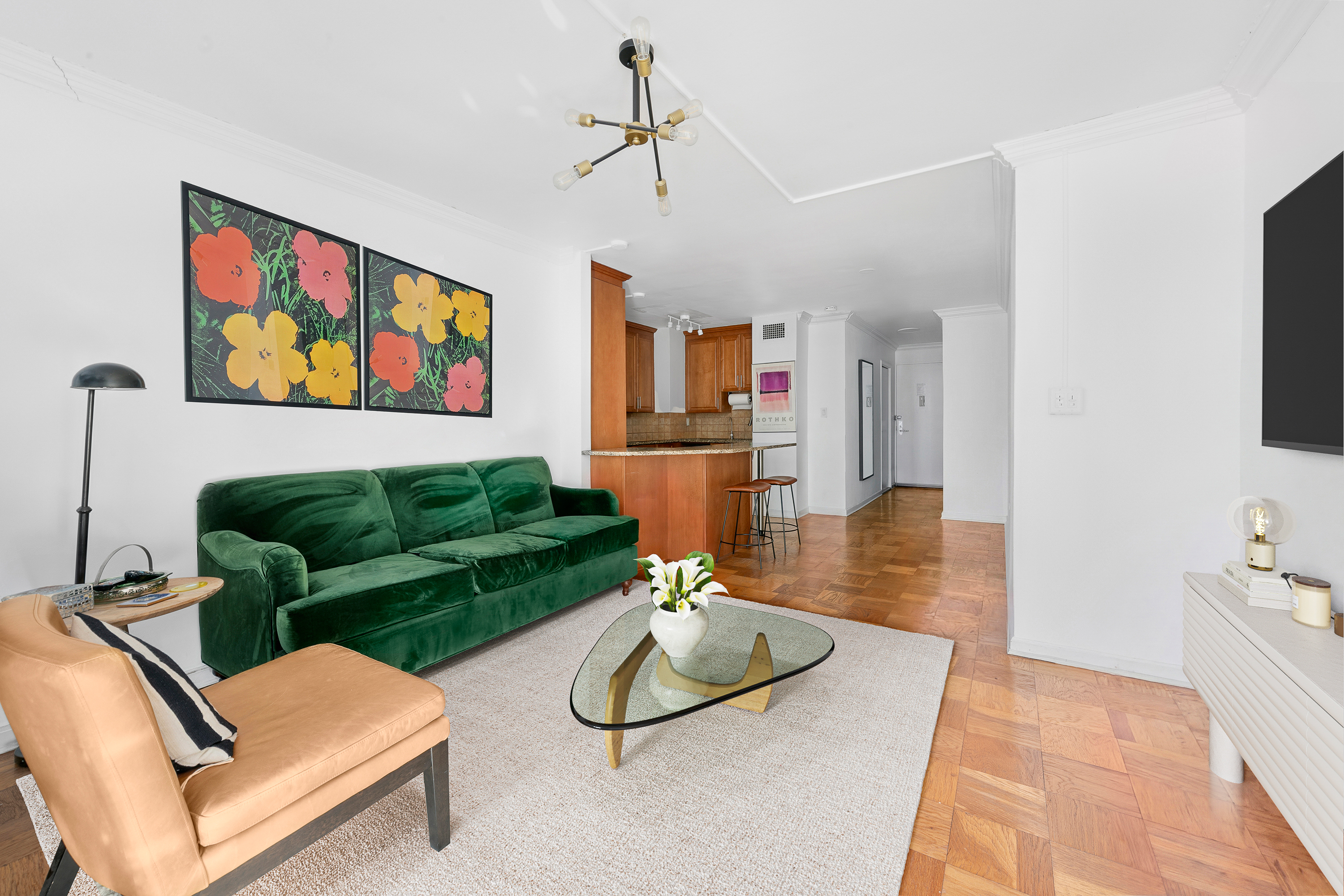 130 East 18th Street, Unit 10M Manhattan, NY 10003 - Photo 3 of 8 a living room with furniture and wooden floor