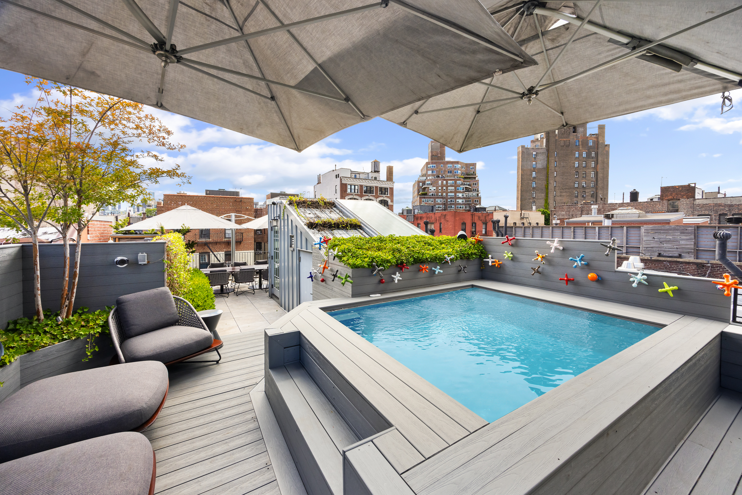 146 Waverly Place Manhattan, NY 10014 - Photo 32 of 41 a view of a swimming pool with a couches in a patio