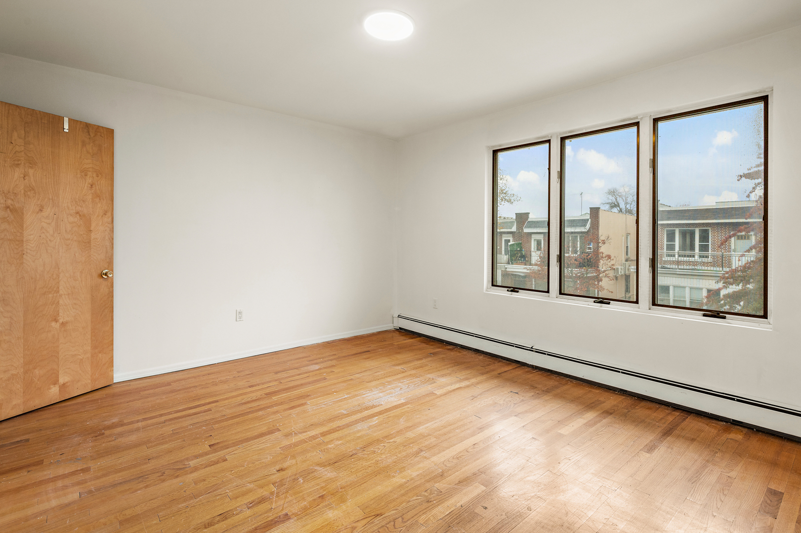 558 84th Street Brooklyn, NY 11209 - Photo 17 of 25 a view of an empty room with a window