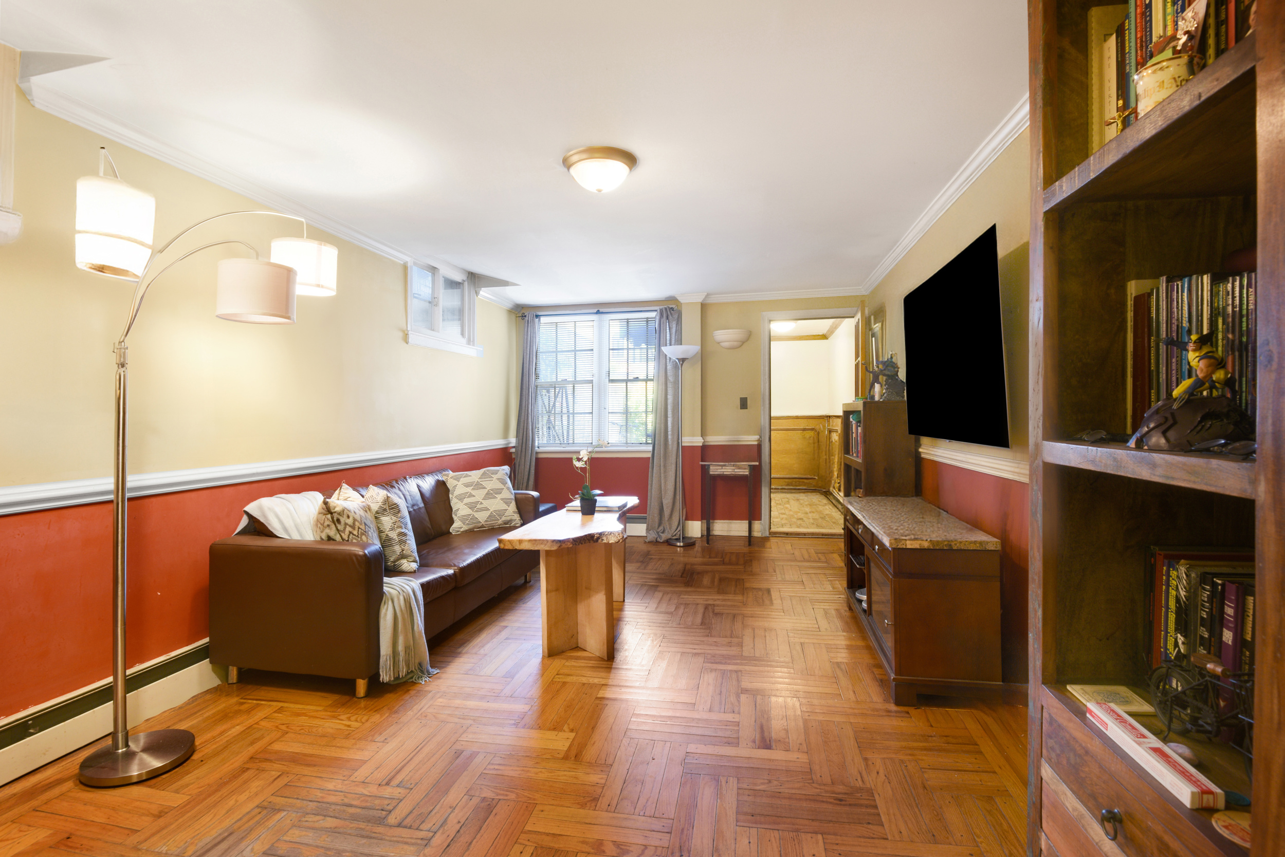 233 Battery Avenue Brooklyn, NY 11209 - Photo 8 of 17 a living room with couches and a flat screen tv