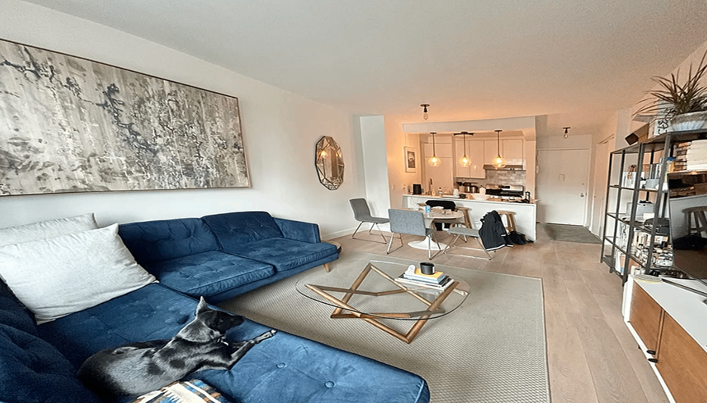 200 Rector Place, Unit 37J Manhattan, NY 10280 - Photo 2 of 12 a living room with furniture and a large window