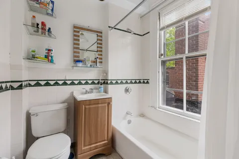 a bathroom with a toilet and a sink