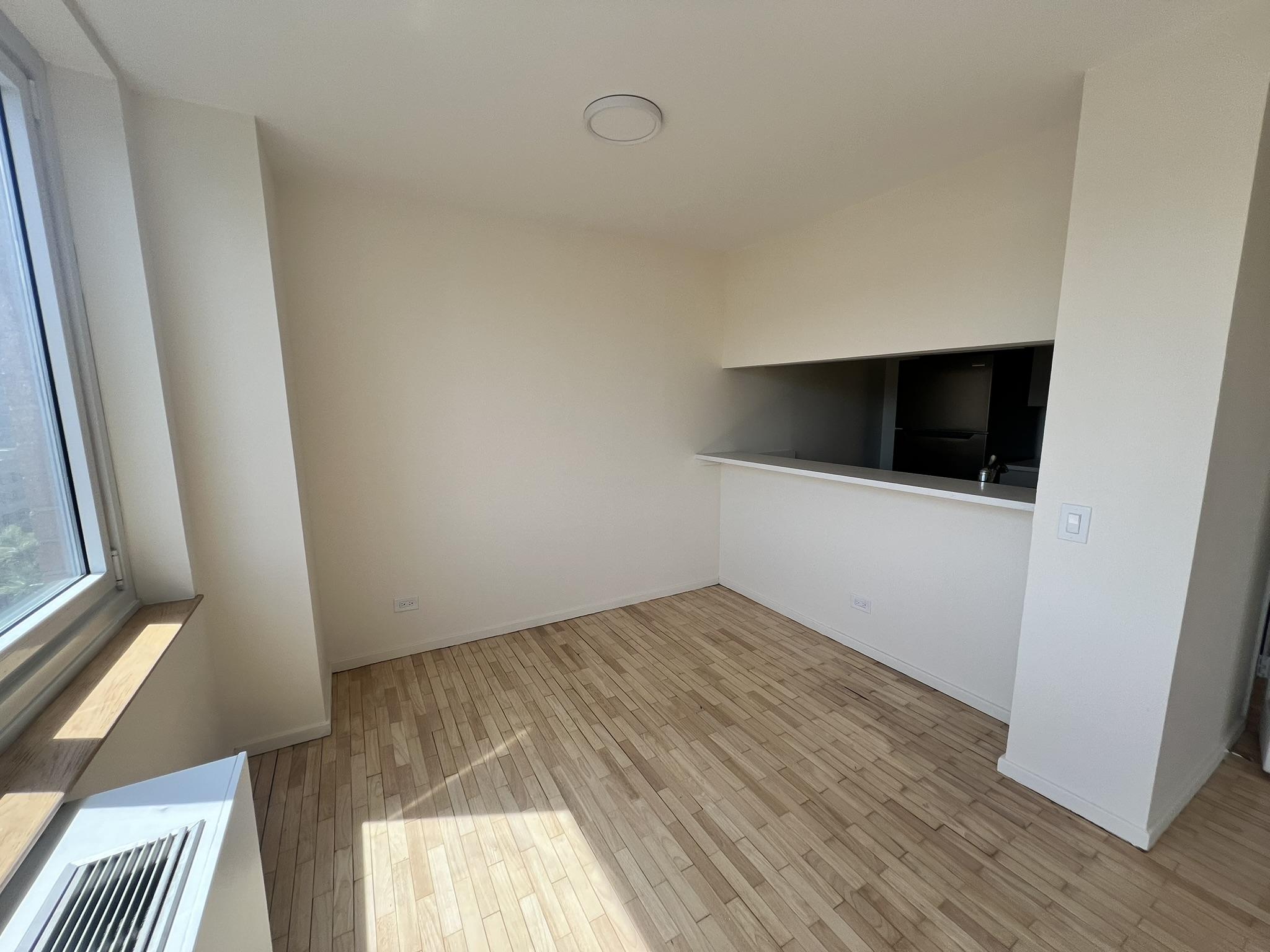 250 West 90th Street, Unit PH2F Manhattan, NY 10024 - Photo 18 of 21 a view of empty room with wooden floor and fan