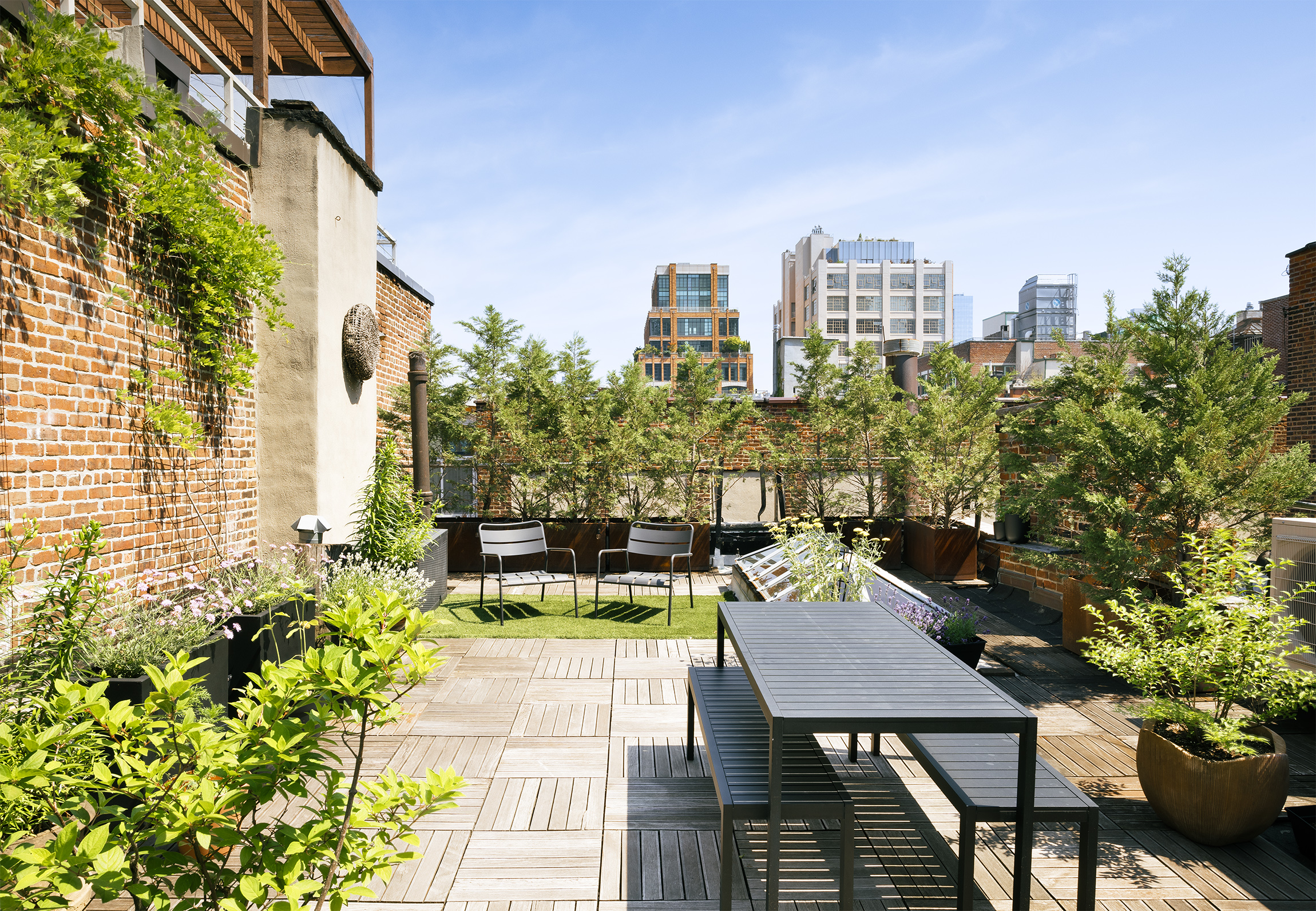 184 Franklin Street, Unit 10 Manhattan, NY 10013 - Photo 7 of 8 a view of a balcony with two chairs and a table