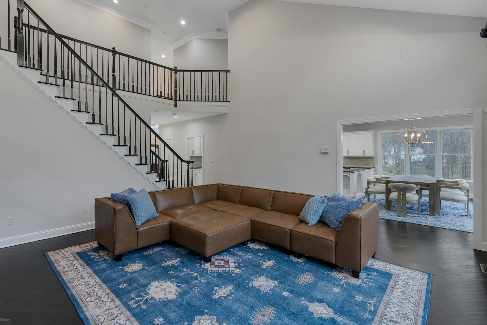 3 Kensington Court Warren, NJ 07059 - Photo 28 of 66 a living room with furniture a rug and kitchen view