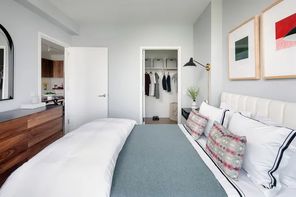 a bedroom with a bed and a couch