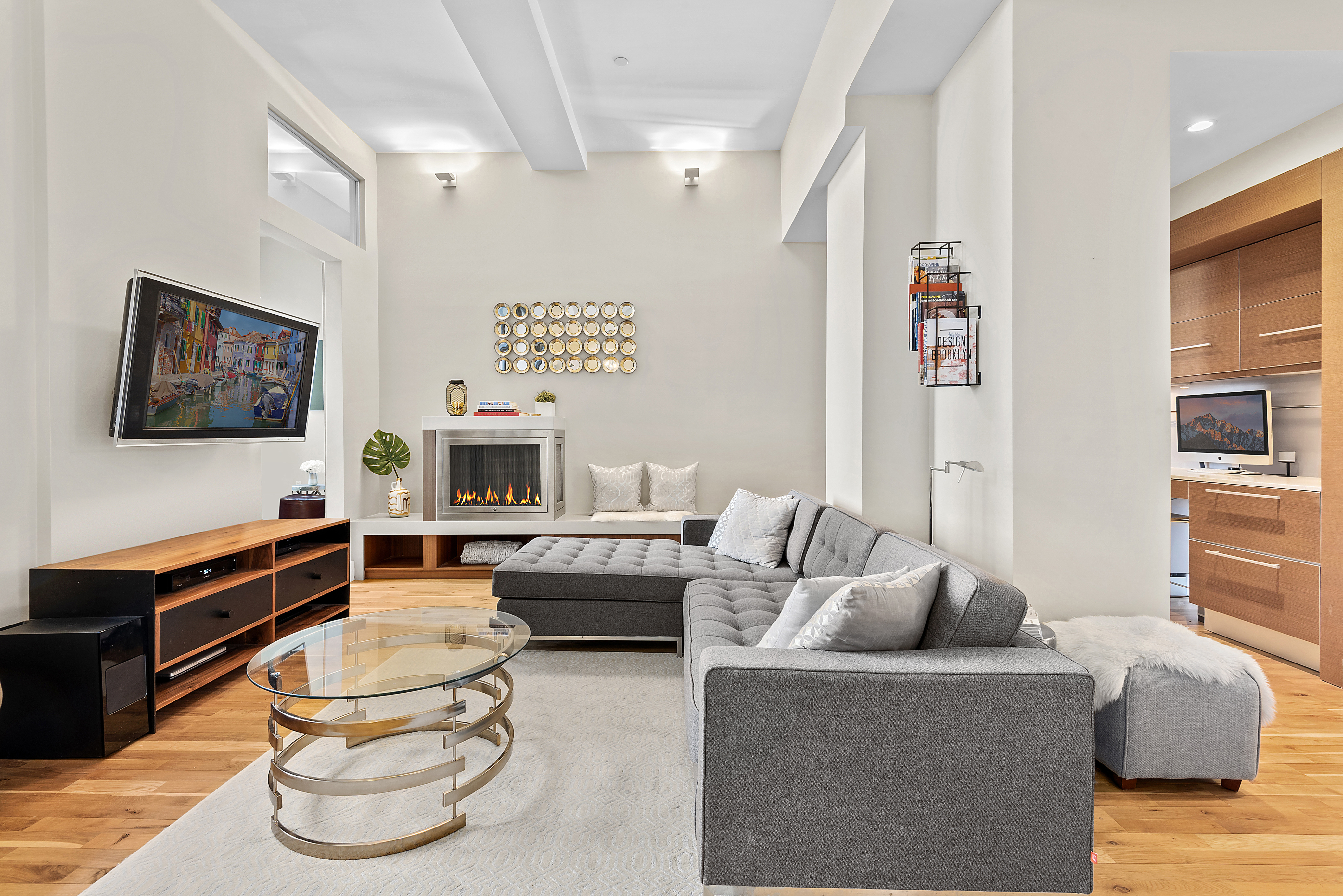 360 Furman Street, Unit 723/724 Brooklyn, NY 11201 - Photo 10 of 63 a living room with furniture and a flat screen tv