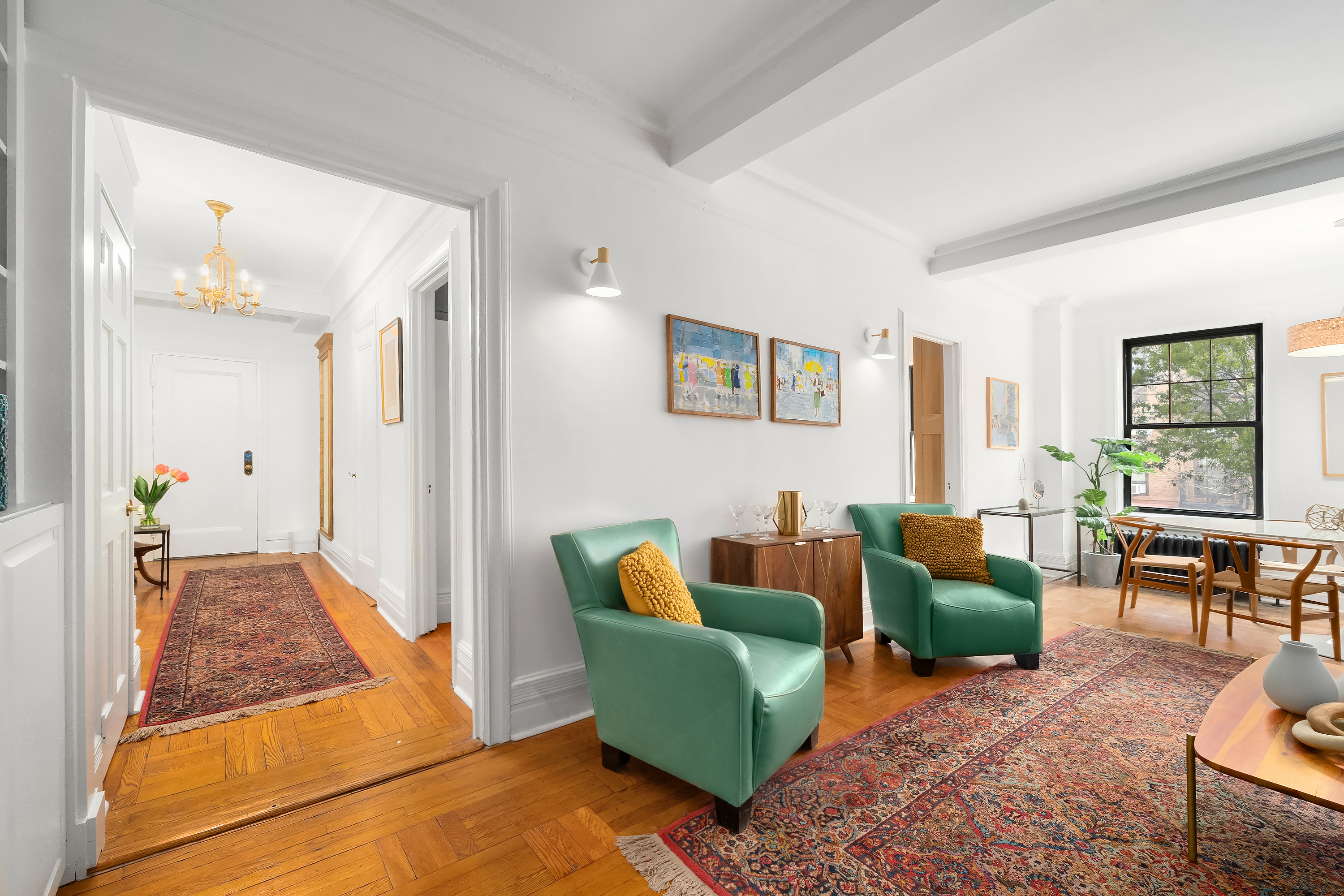 170 2nd Avenue, Unit 2D Manhattan, NY 10003 - Photo 3 of 11 a living room with furniture and a couch