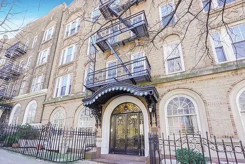 a view of a brick building with a large windows