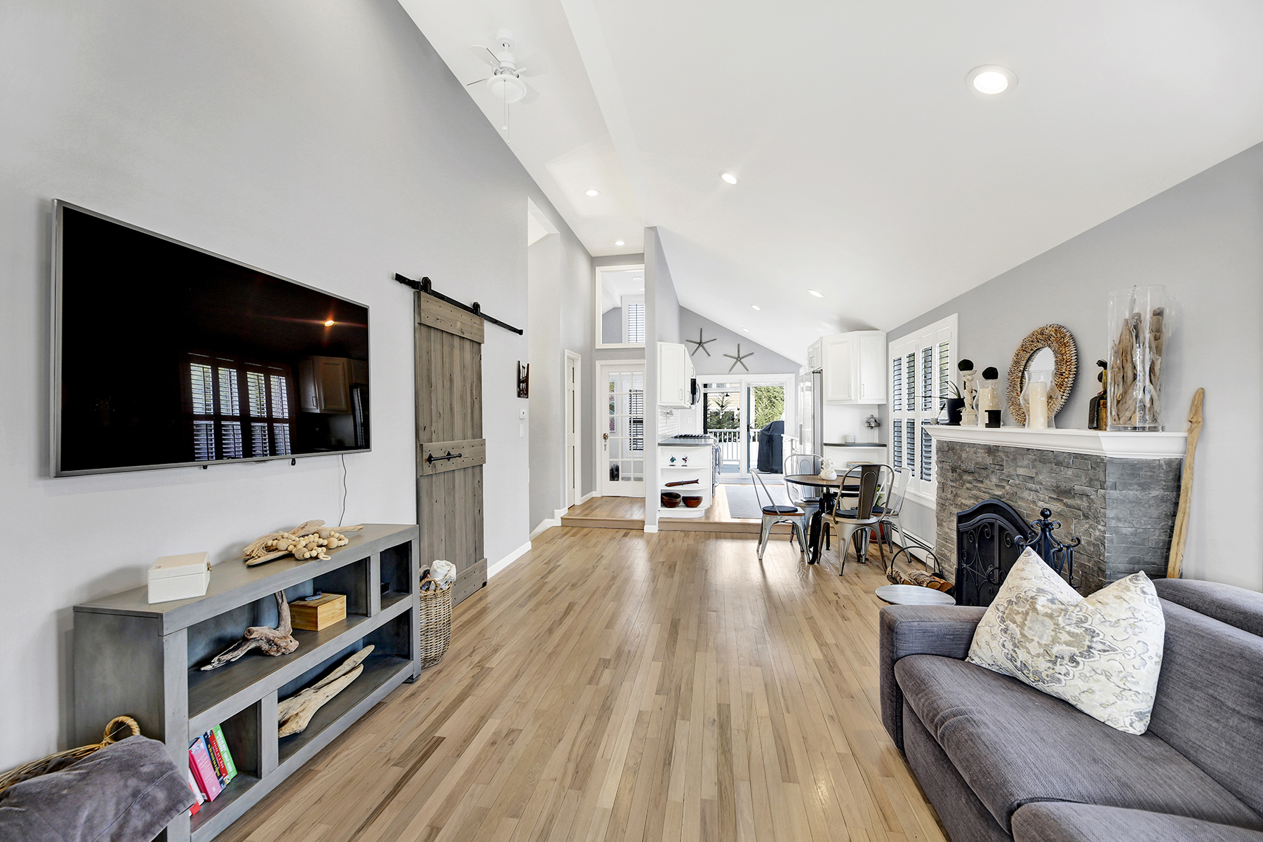 4-53 Beach 142nd Street Queens, NY 11694 - Photo 6 of 39 a living room with furniture and a fireplace