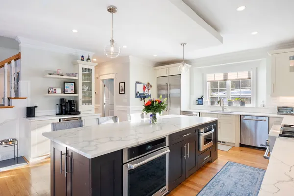 a open kitchen with stainless steel appliances granite countertop stove a sink dishwasher and a refrigerator