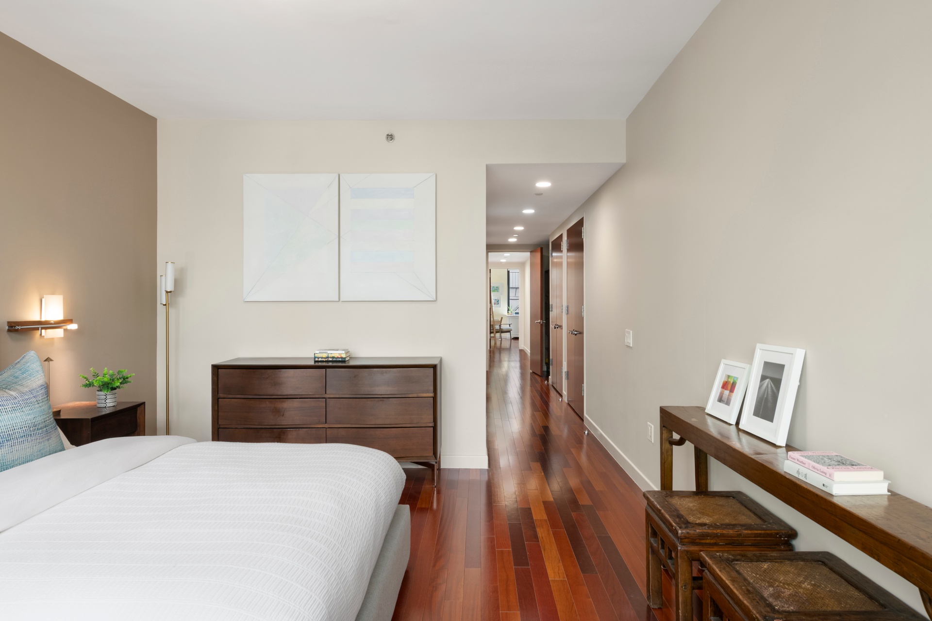 50 West 15th Street, Unit 2D Manhattan, NY 10011 - Photo 5 of 15 a bedroom with a bed and wooden floor