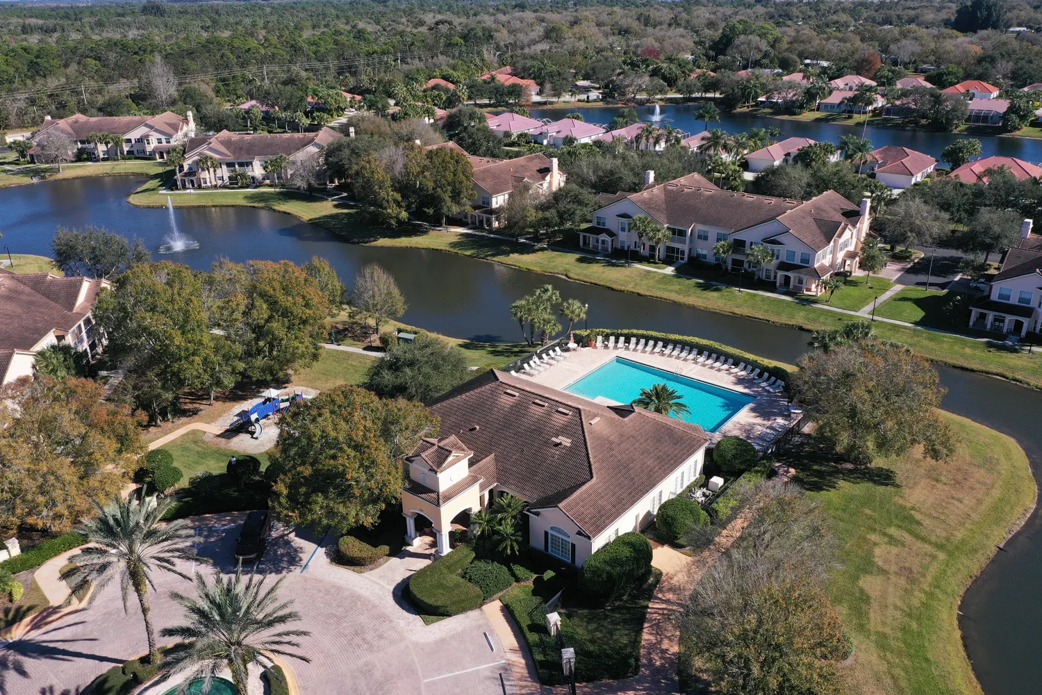 a living room filled with furniture and a chandelier