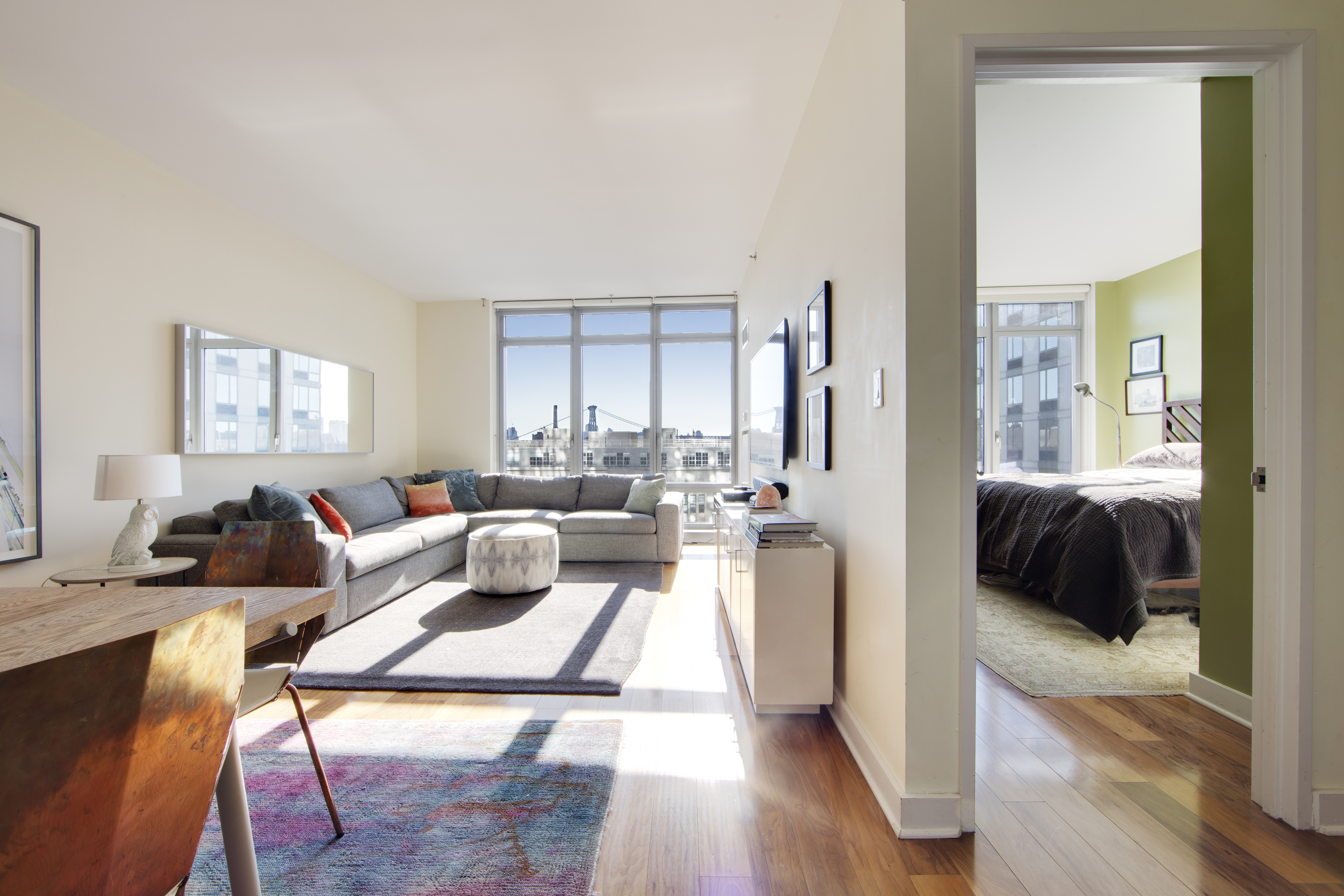 2 Northside Piers, Unit 10B Brooklyn, NY 11249 - Photo 4 of 14 a living room with furniture and a large window