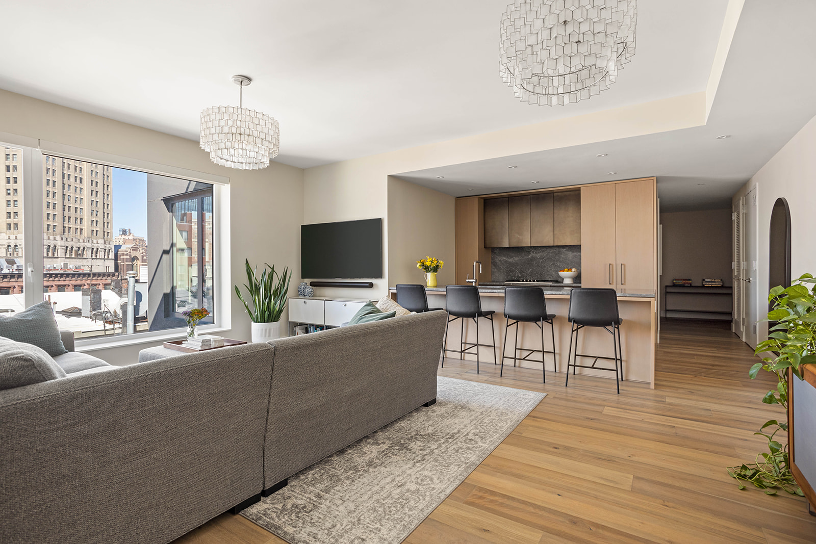 561 Pacific Street, Unit 606 Brooklyn, NY 11217 - Photo 2 of 17 a living room with furniture wooden floor and a flat screen tv