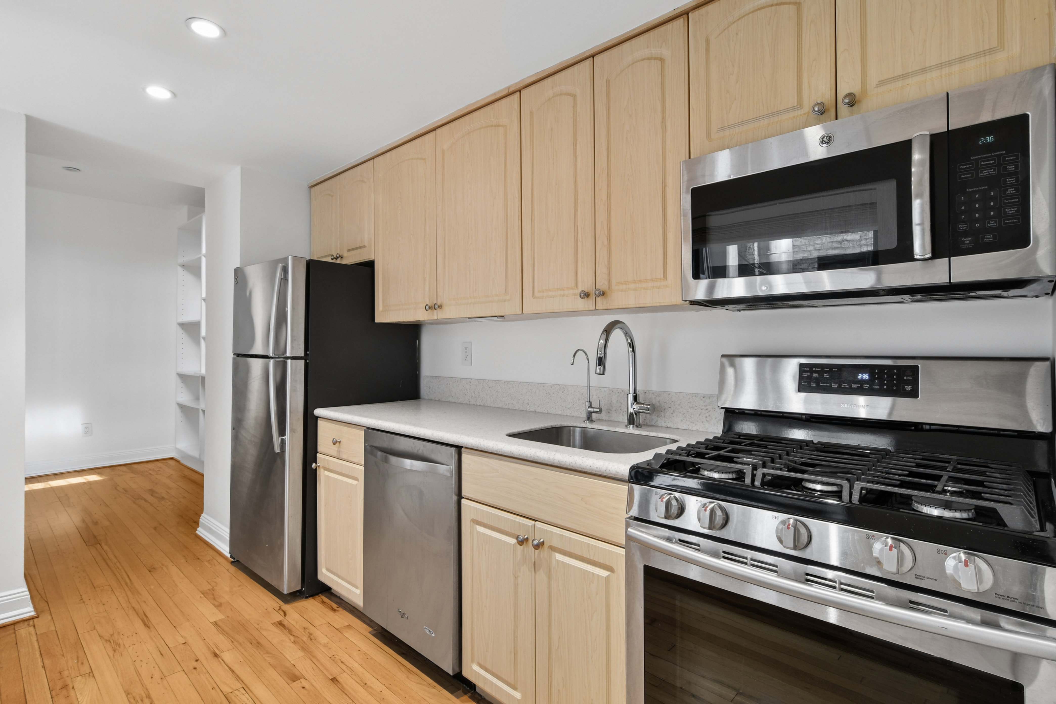 109 East 38th Street, Unit 3A Manhattan, NY 10016 - Photo 4 of 13 a kitchen with a stove and a microwave