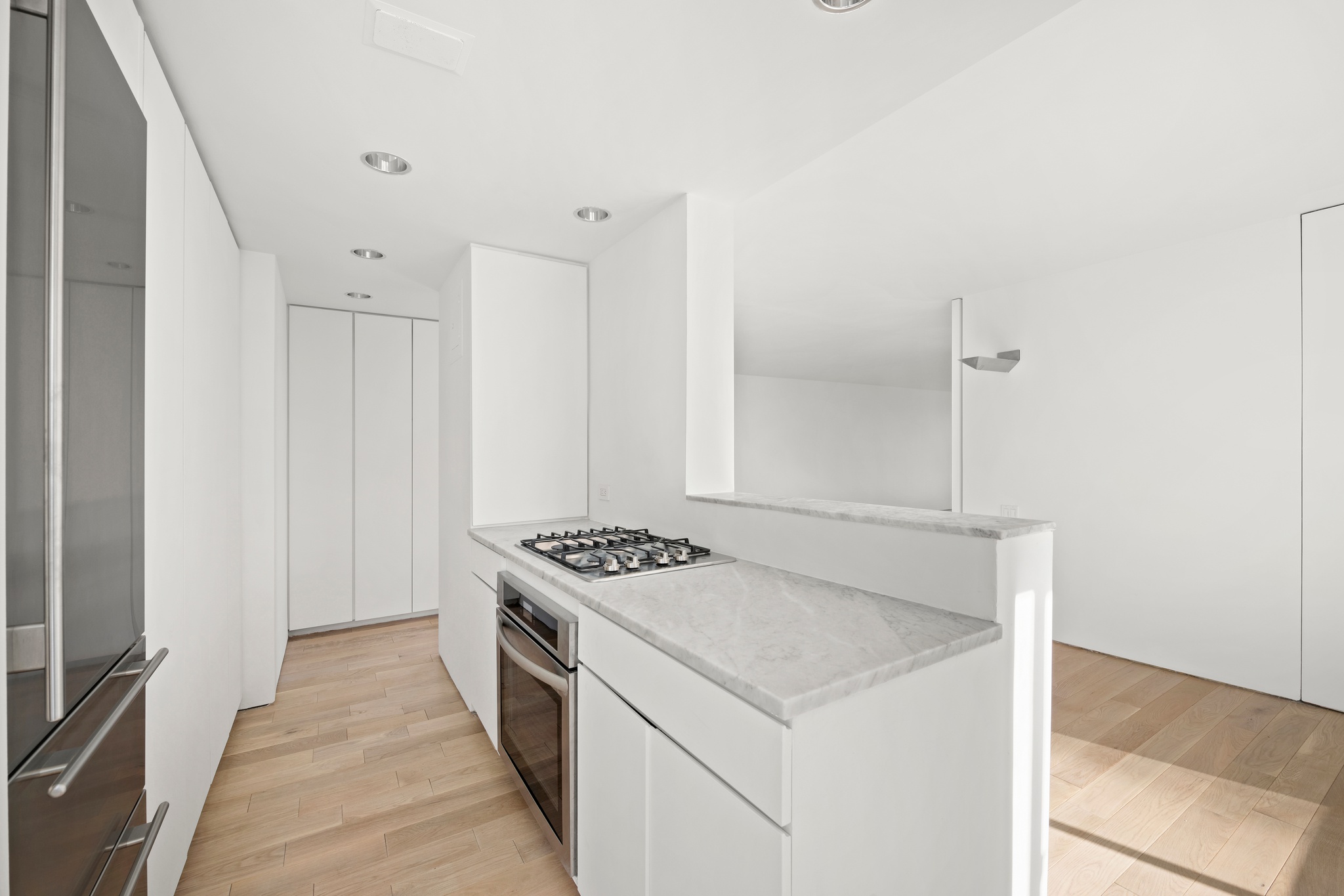 530 East 72nd Street, Unit 14E Manhattan, NY 10021 - Photo 9 of 19 a kitchen that has a stove and a table
