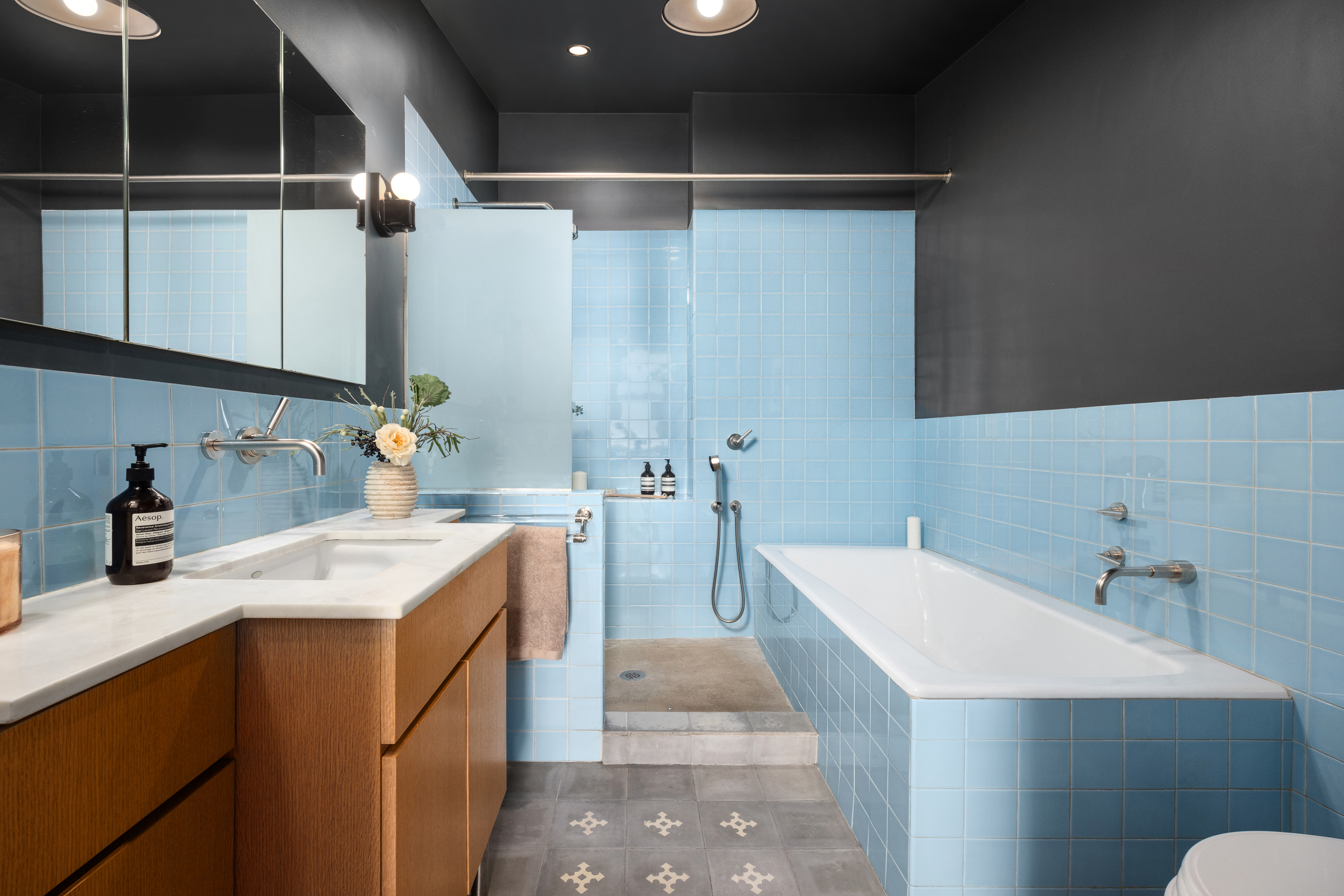 874 Broadway, Unit 501 Manhattan, NY 10003 - Photo 12 of 17 a bathroom with a sink and mirror