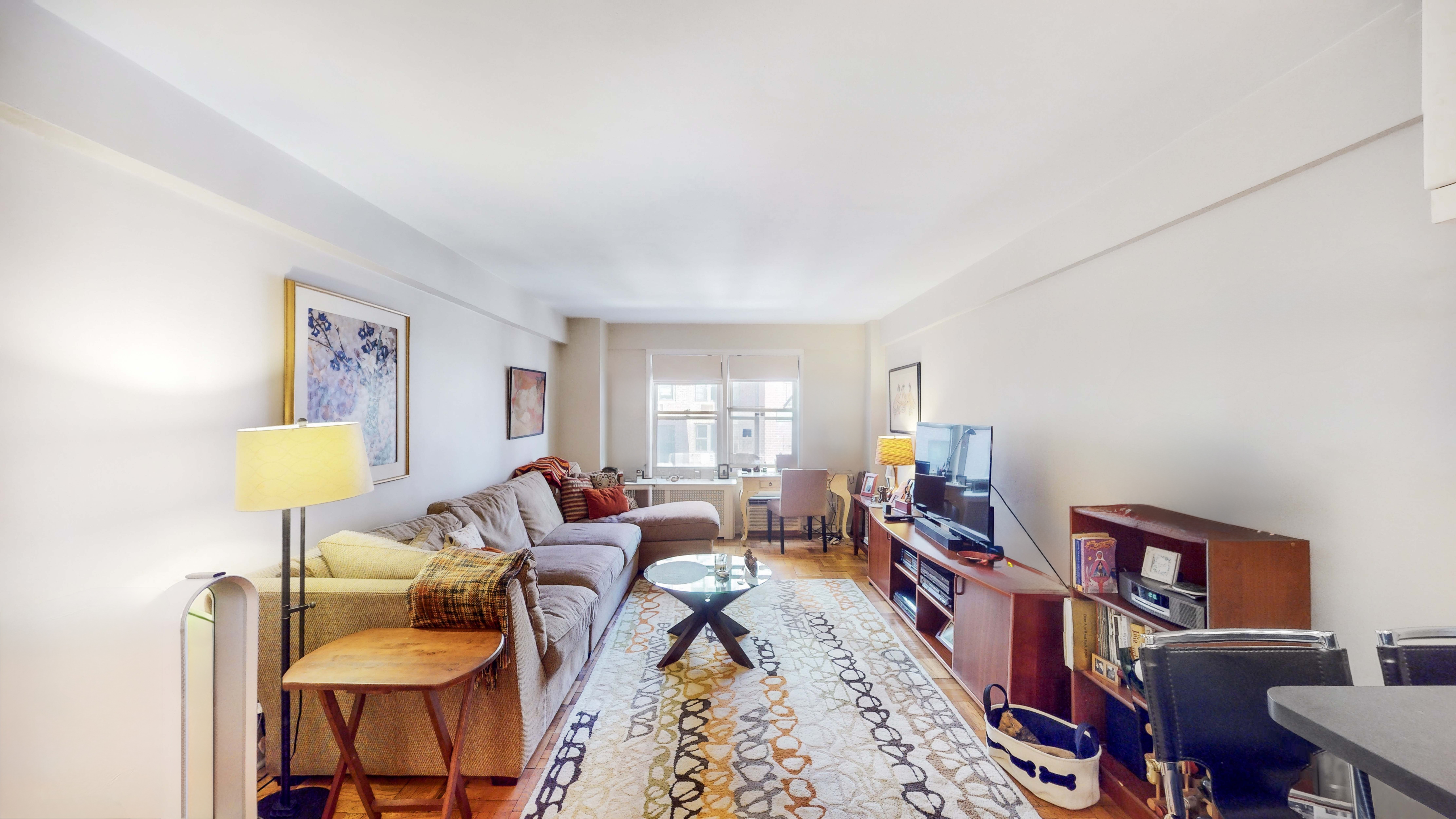 a living room with furniture and a window