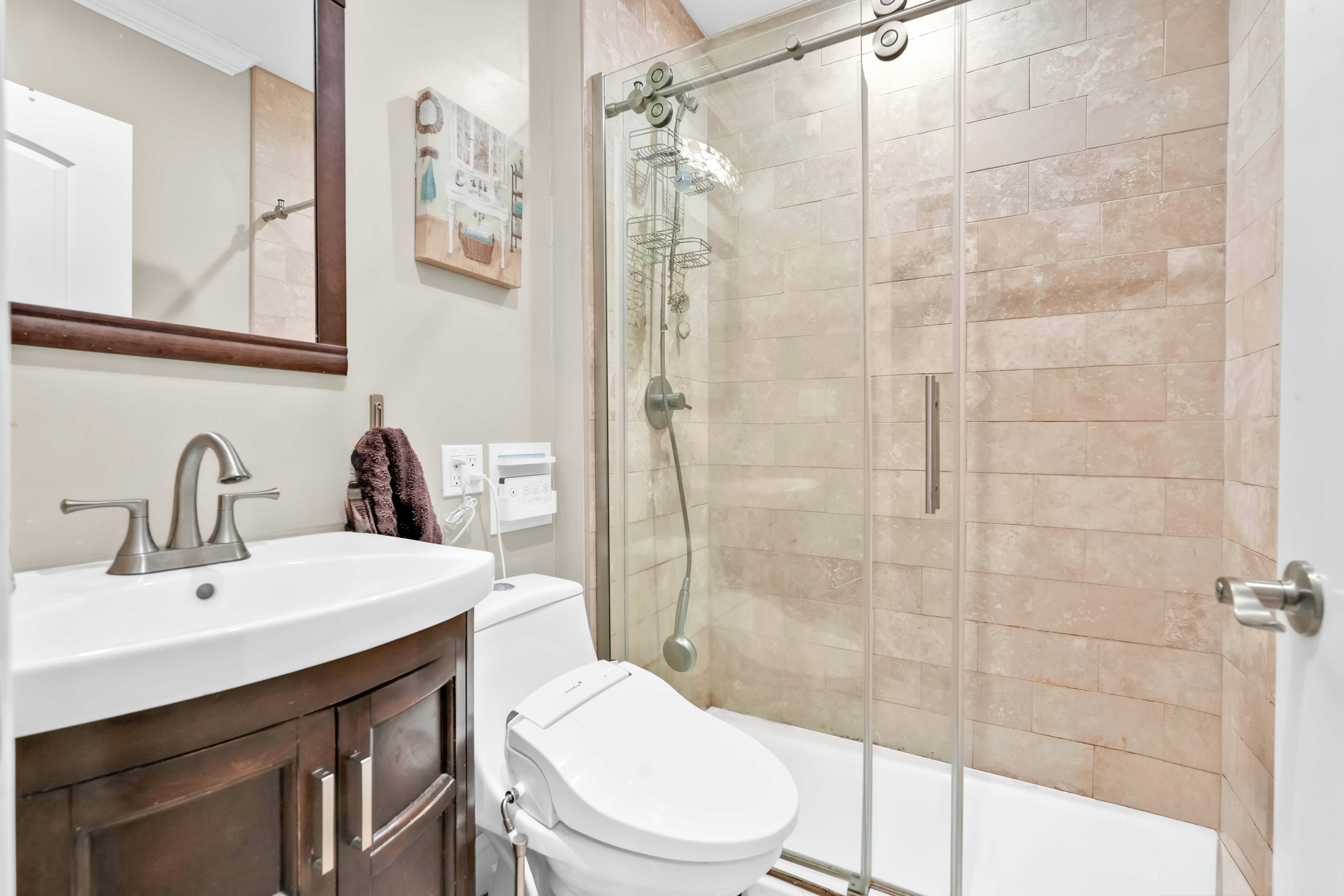 519 Monroe Street Brooklyn, NY 11221 - Photo 15 of 55 a bathroom with a sink a toilet and shower