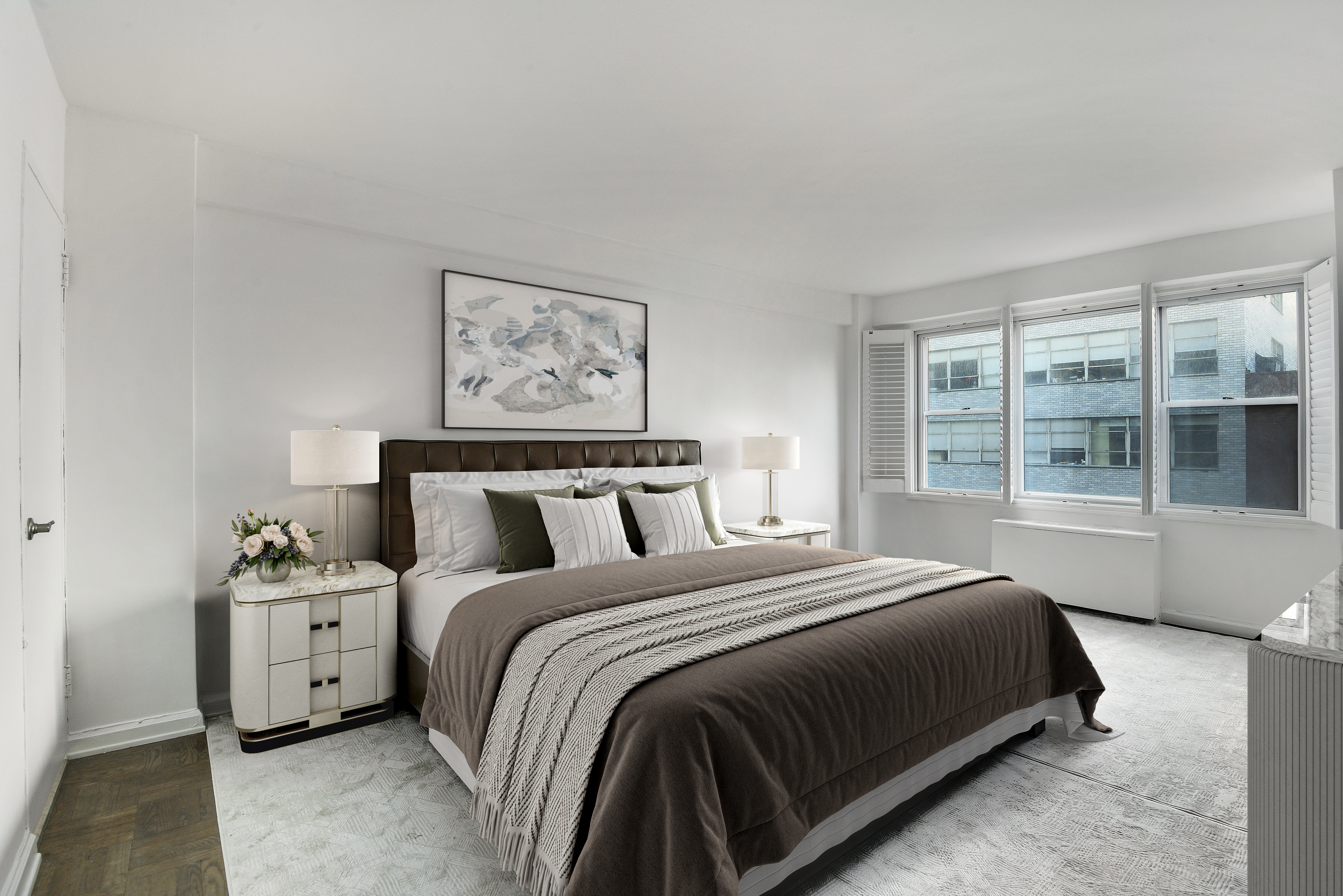 150 East 61st Street, Unit 5C Manhattan, NY 10065 - Photo 11 of 18 a large bed sitting in a bedroom next to a window