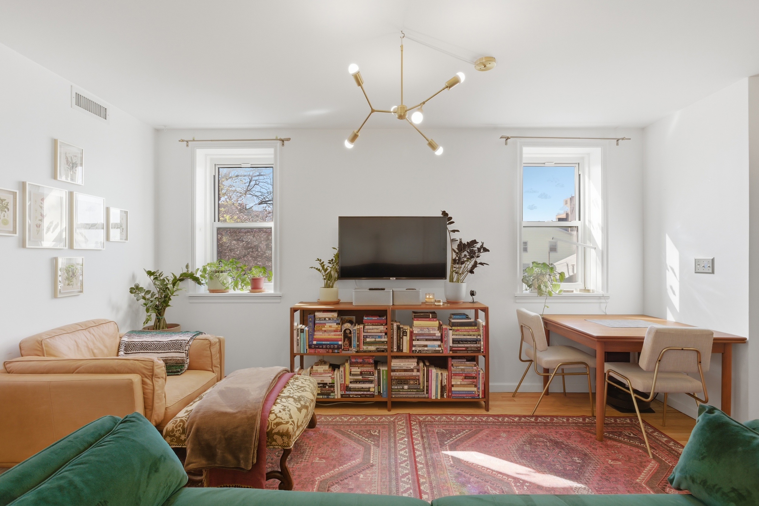 392 11th Street, Unit 3A Brooklyn, NY 11215 - Photo 8 of 11 a living room with furniture and a flat screen tv