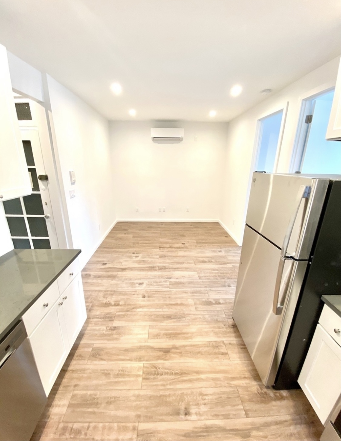 31-14 36th Street, Unit 3F Queens, NY 11106 - Photo 5 of 11 a view of kitchen and wooden floor