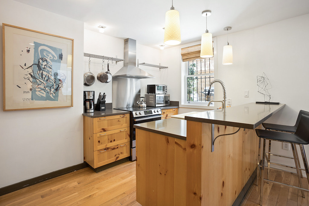 315 Washington Avenue Brooklyn, NY 11205 - Photo 32 of 38 a kitchen with stainless steel appliances a sink a stove a refrigerator and cabinets