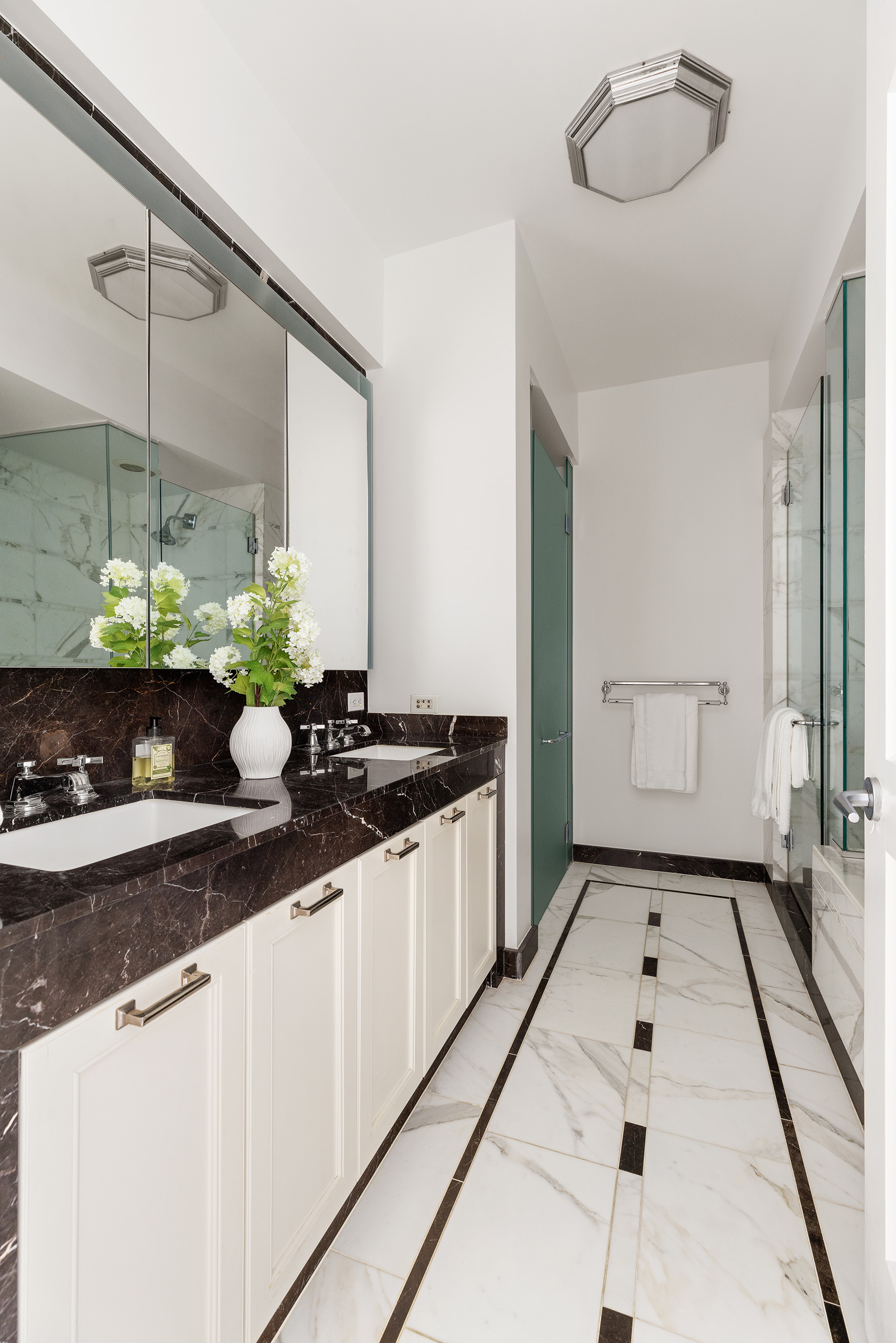 205 East 85th Street, Unit 19B Manhattan, NY 10028 - Photo 6 of 9 a kitchen with a sink and a stove