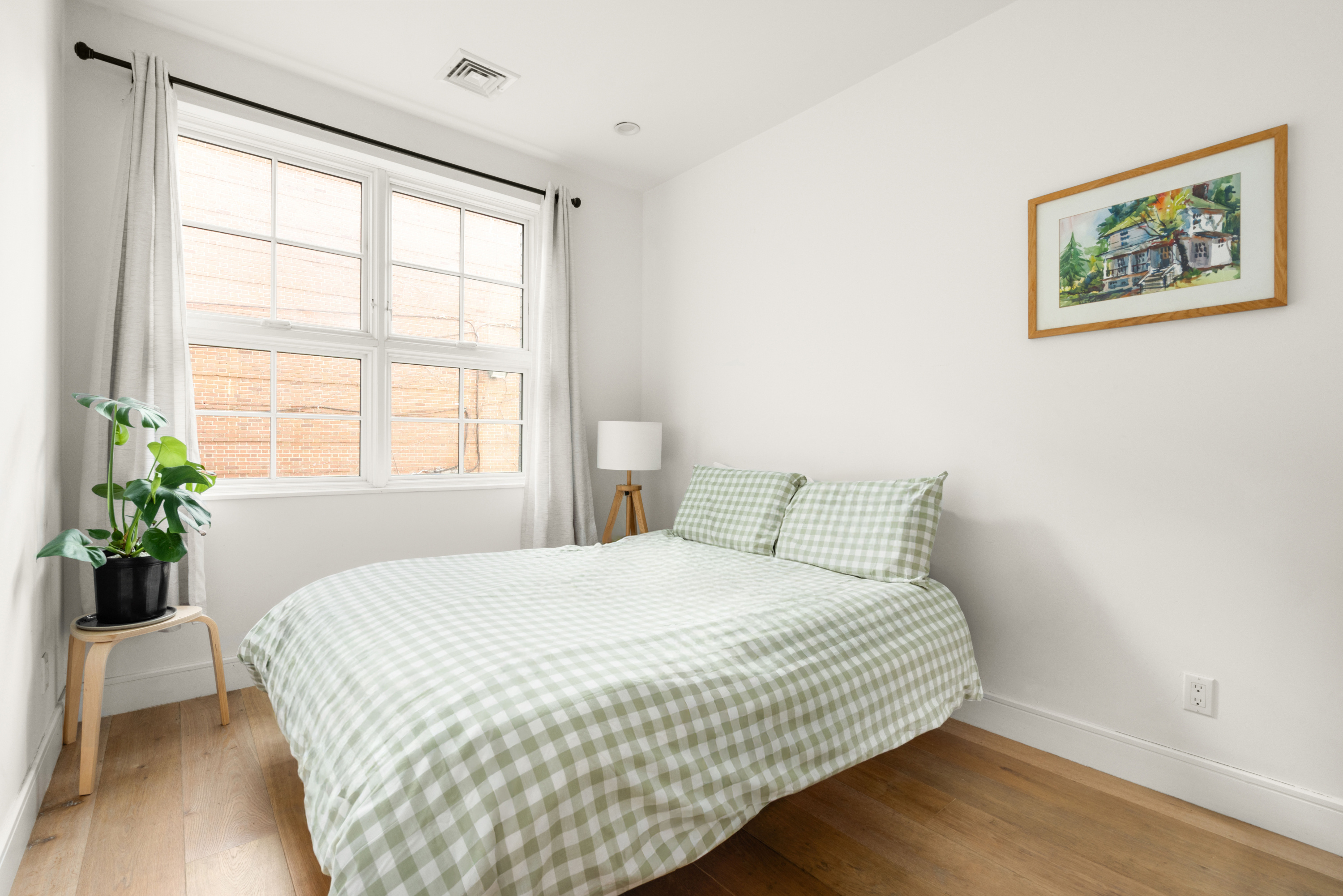 40 Huntington Street, Unit 2C Brooklyn, NY 11231 - Photo 7 of 9 a bedroom with a bed and a large window