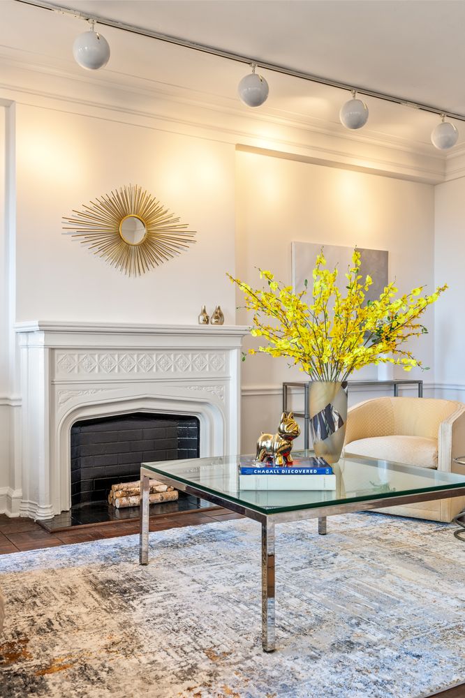 a living room with a couch and a fireplace