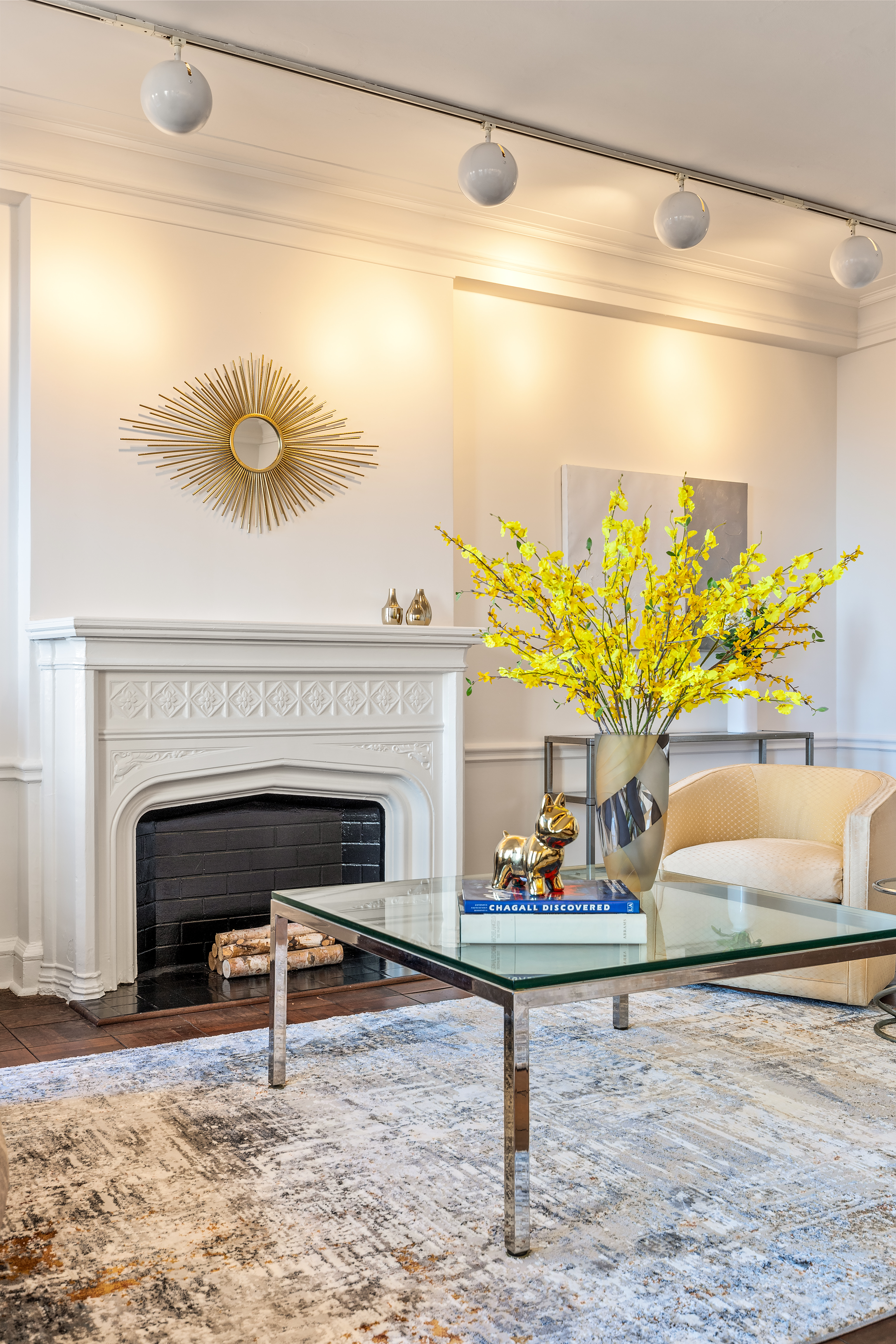 115 Central Park West, Unit 16H Manhattan, NY 10023 - Photo 4 of 30 a living room with a couch and a fireplace