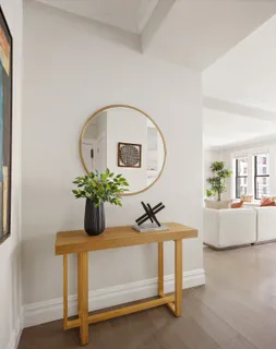 a view of living room with furniture and potted plant